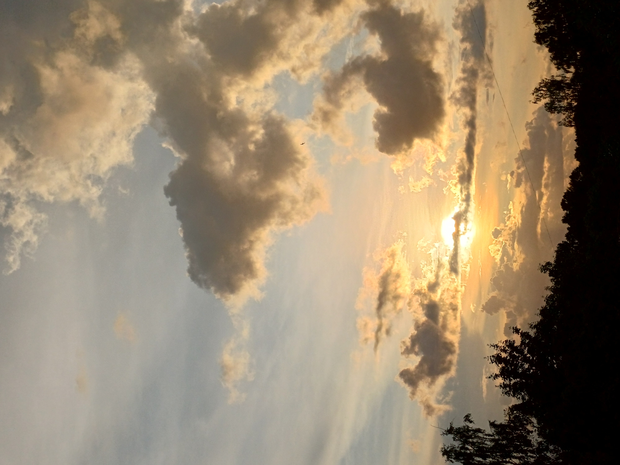 Dramatic cloud-broken sunset over Riga's outskirts