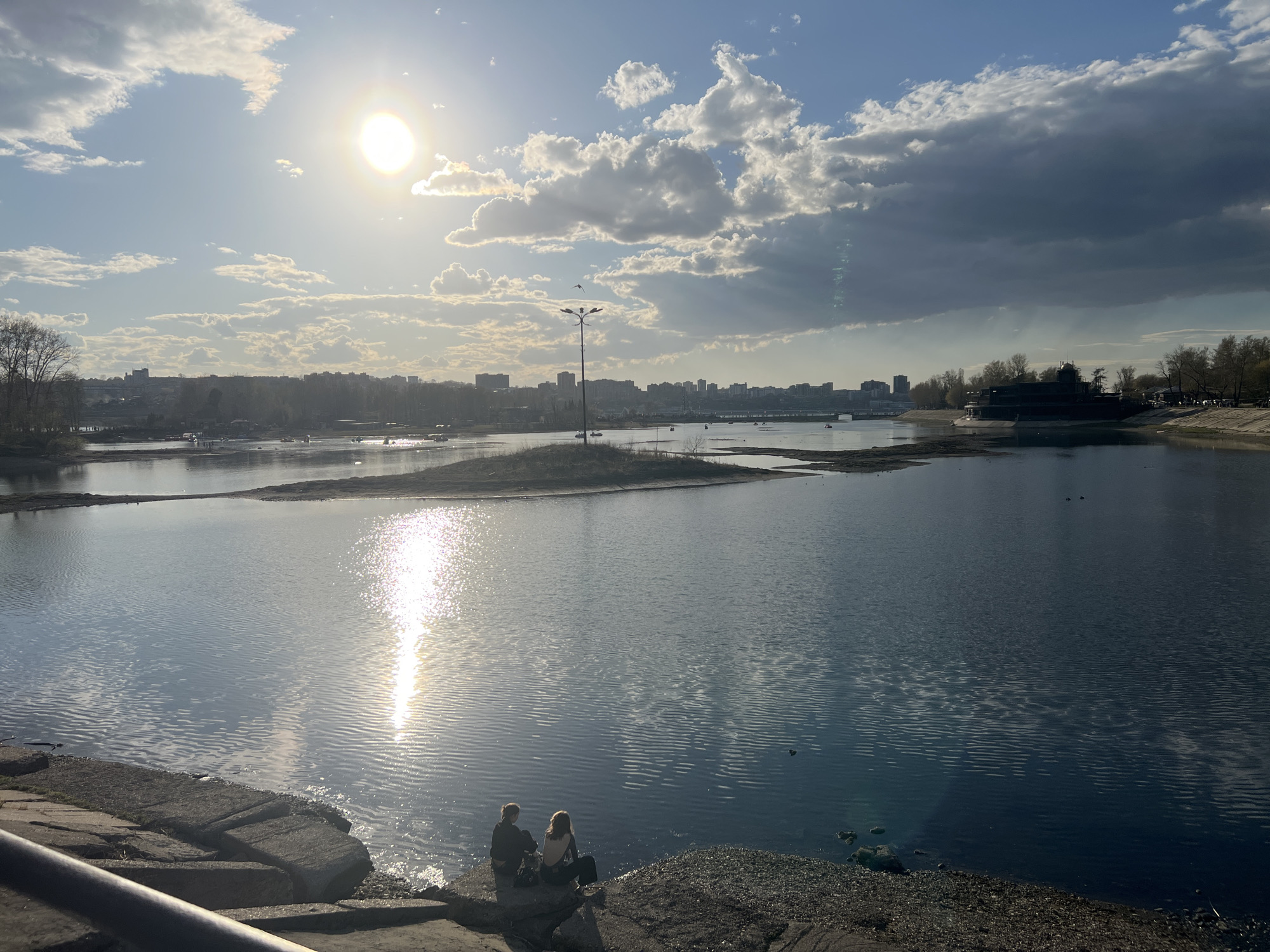 Morning scenes captured across Irkutsk showing river, buildings, church
