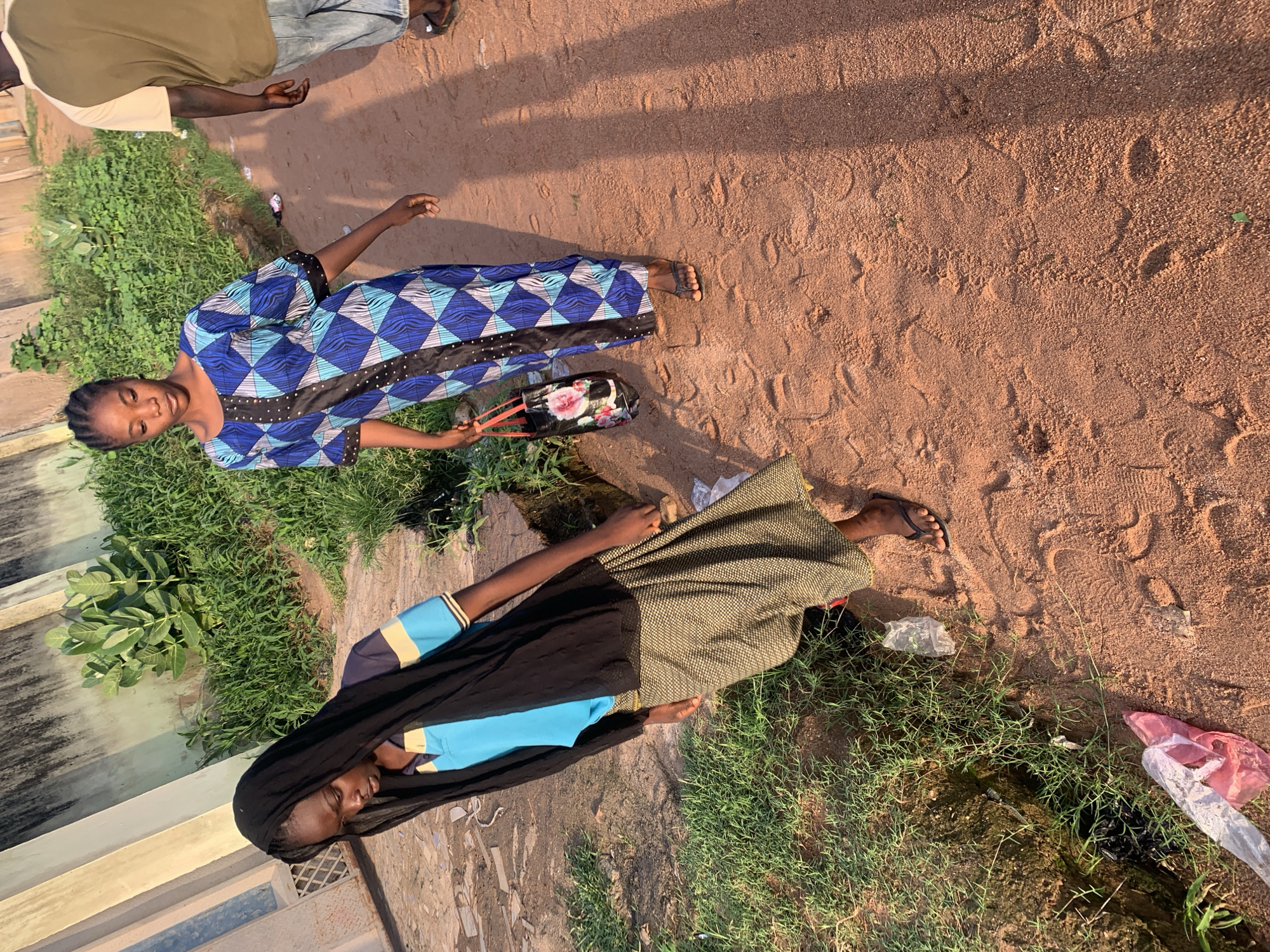 Morning street life in a Jalingo residential neighborhood