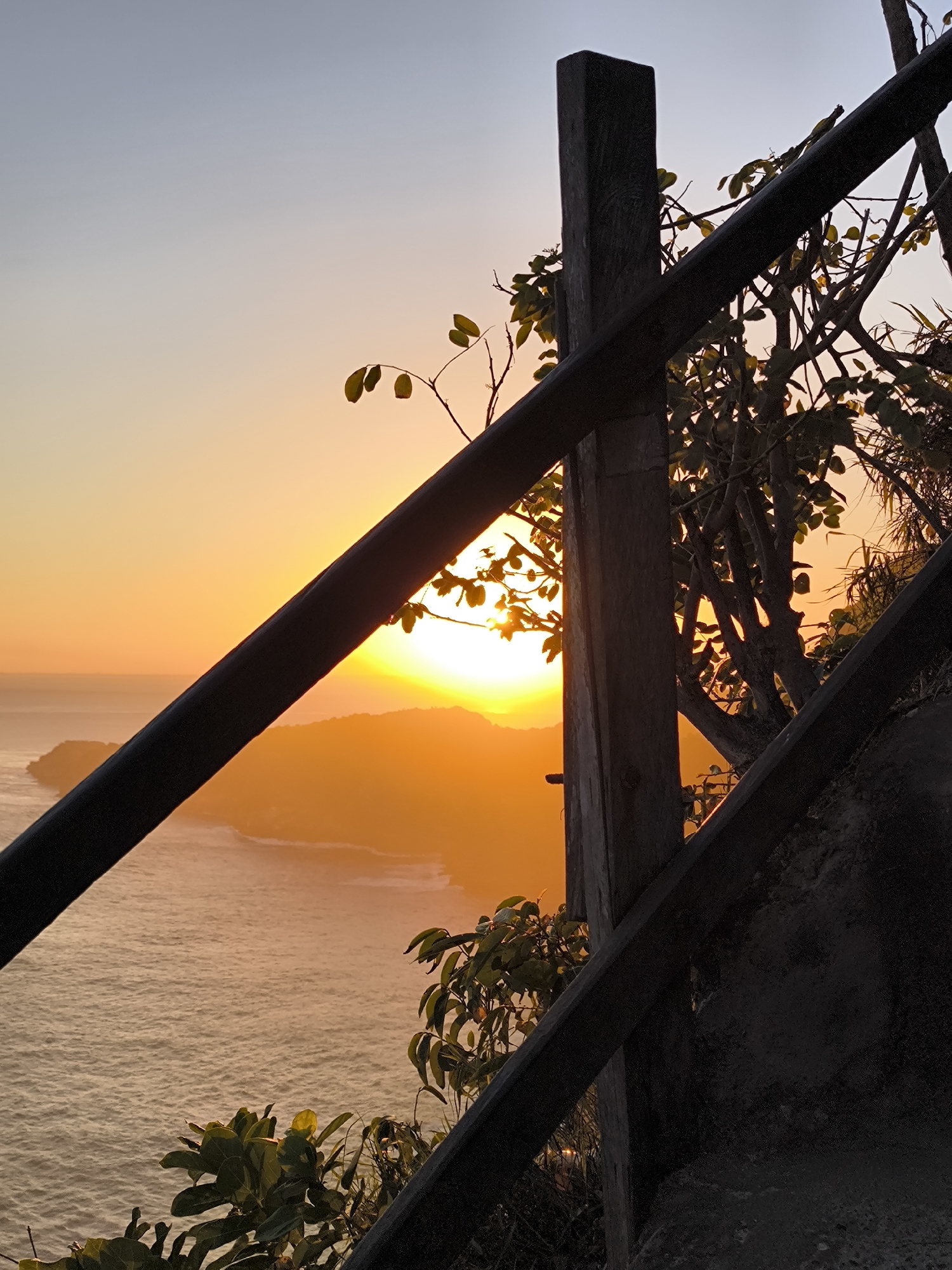 Sunset observed from wooden viewpoint near Nusa Penida, Indonesia