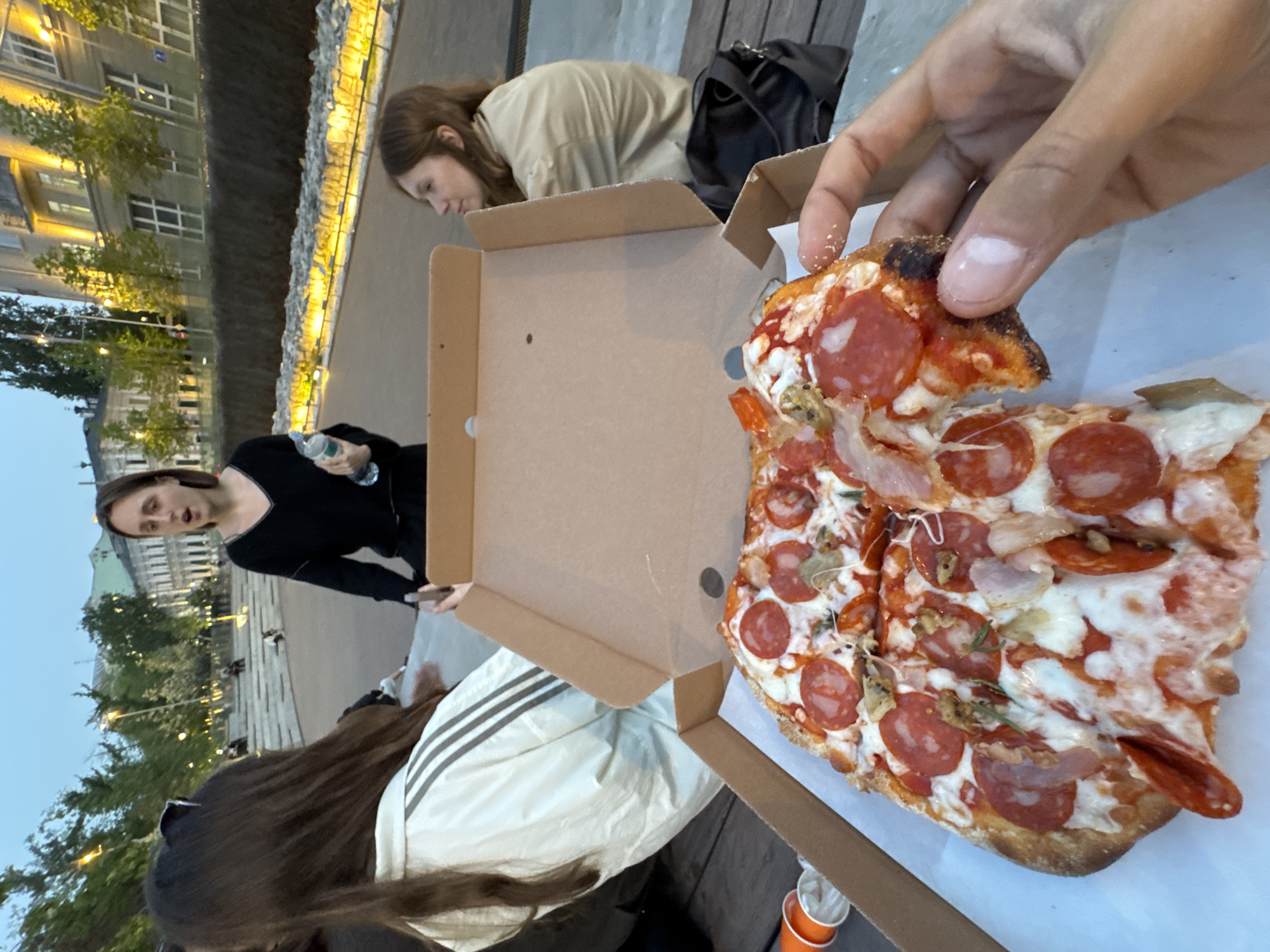 Group shares pizza at Moscow's Zaryadye Park