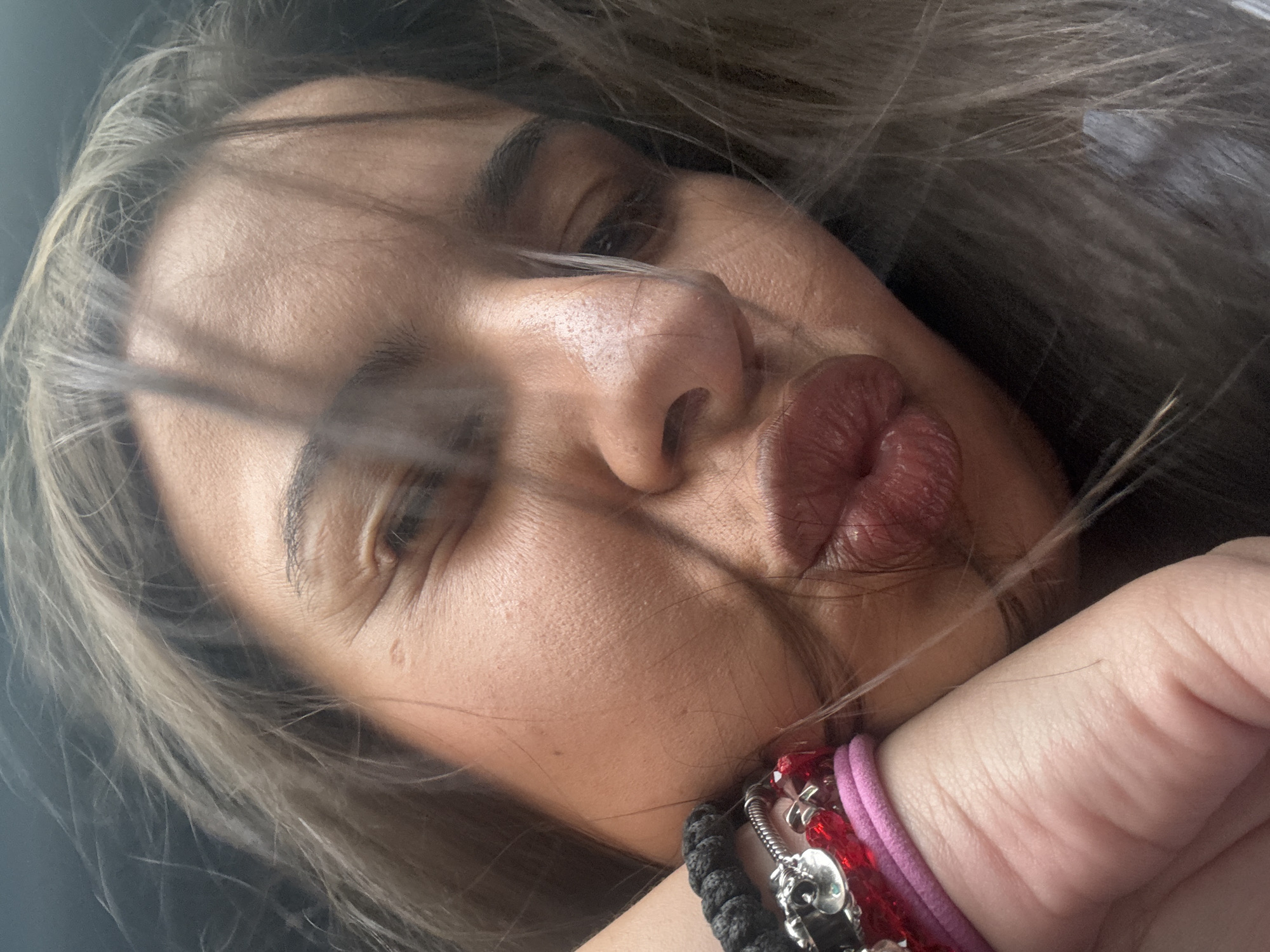 Woman takes kissing selfie in Velingrad, Bulgaria