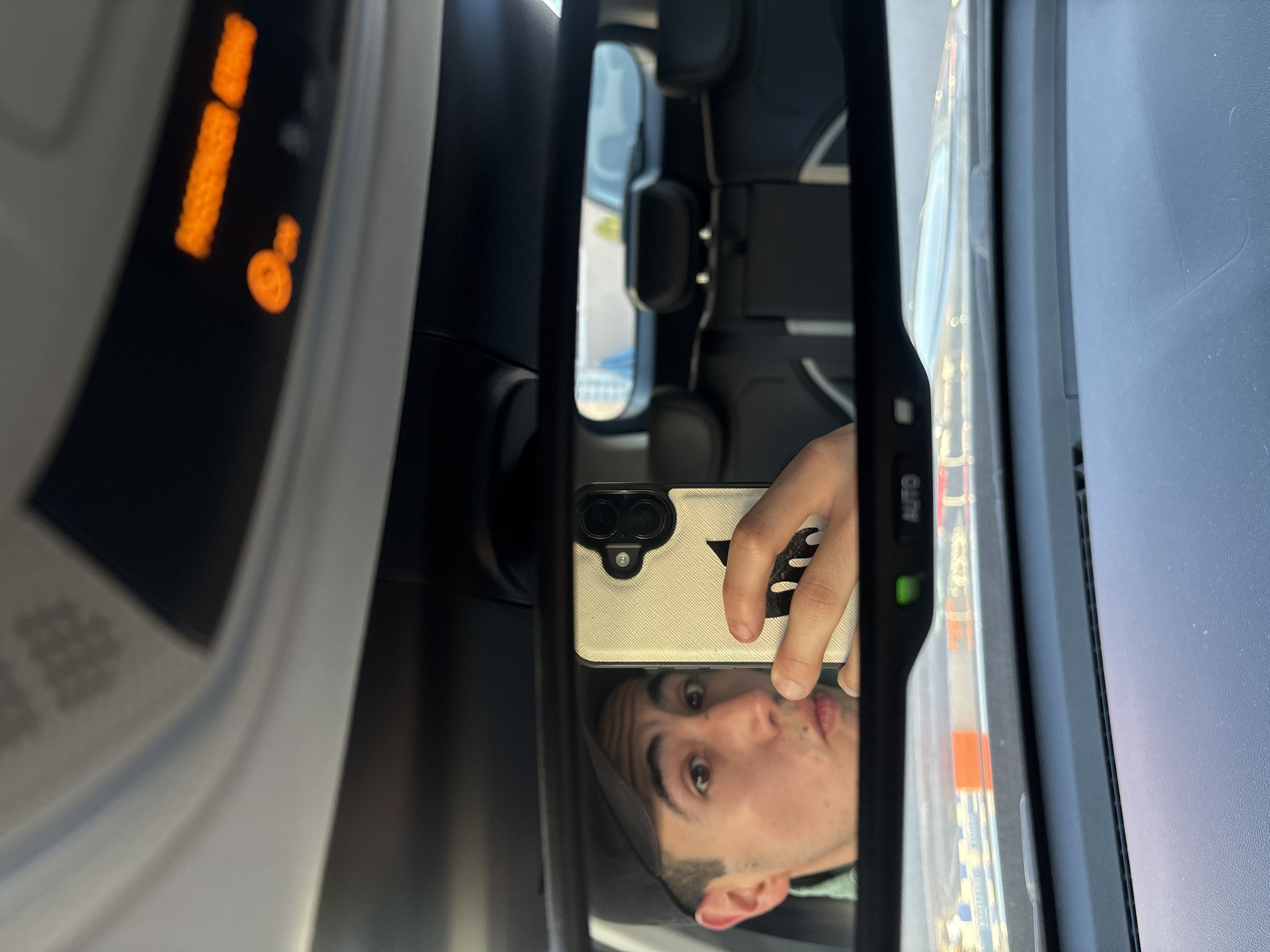 Young man observed in car mirror, Mexico
