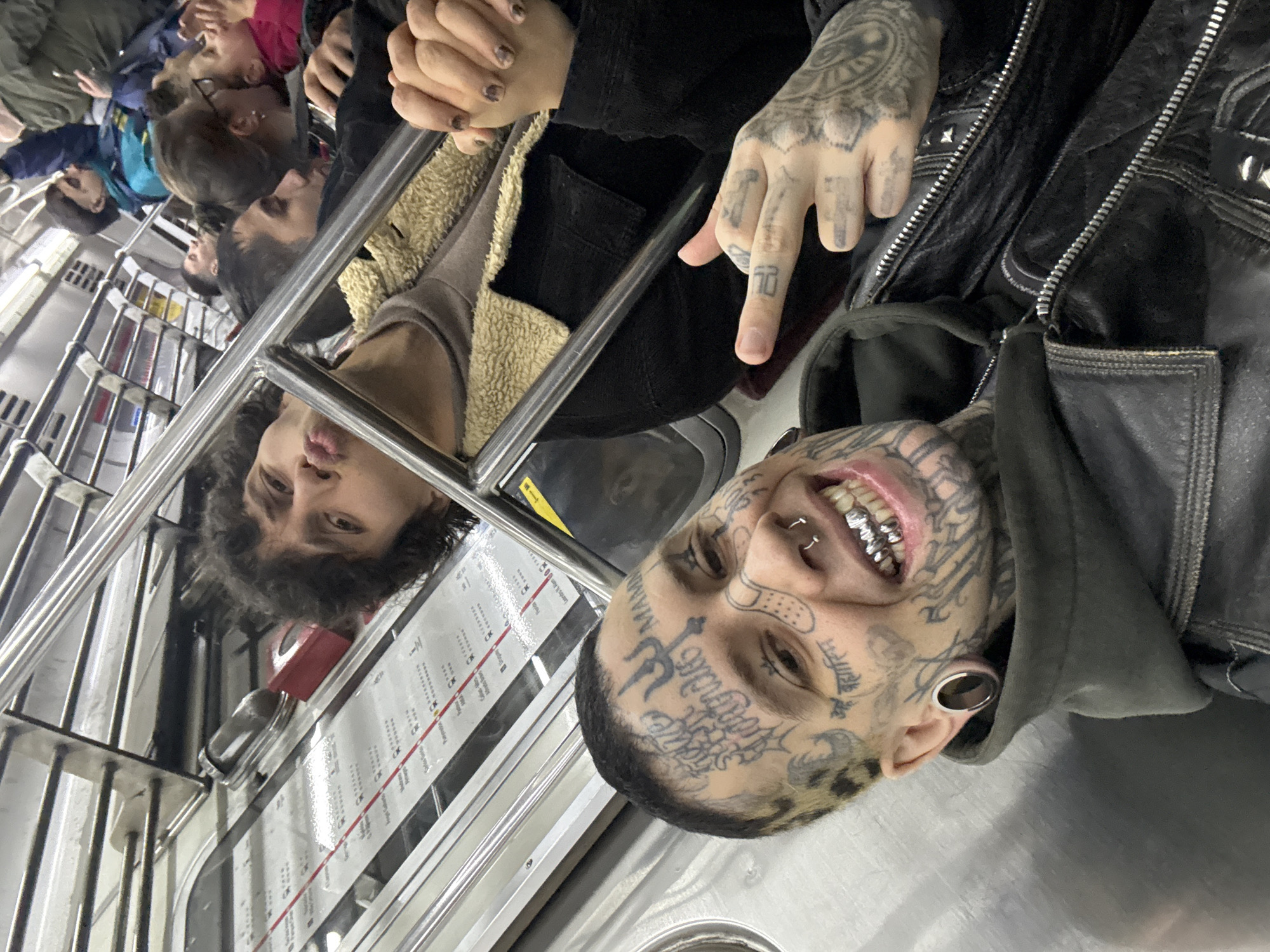 Tattooed passenger with silver grill spotted on Buenos Aires subway