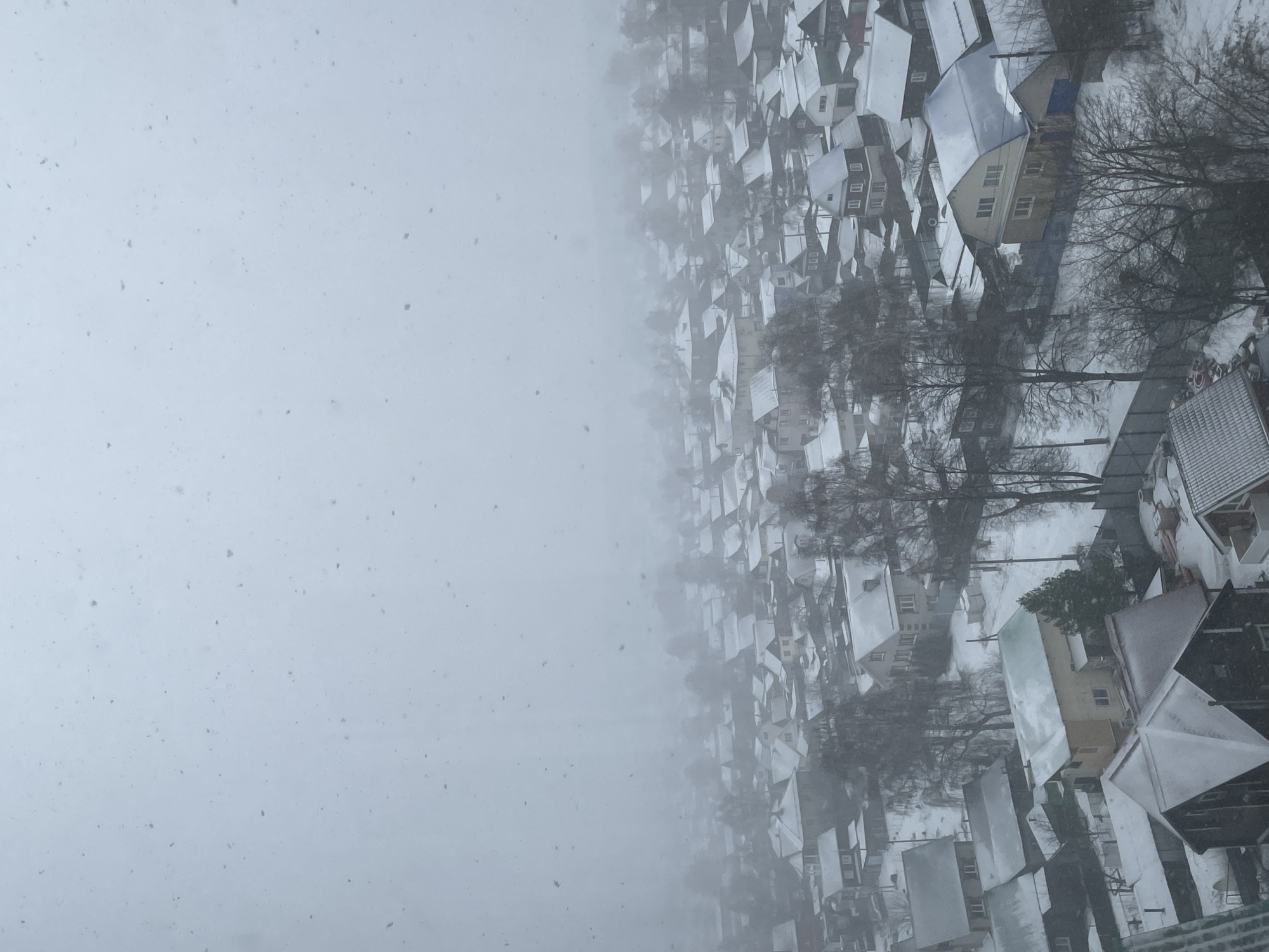 Heavy snowfall blankets residential Izhevsk, Russia morning hours