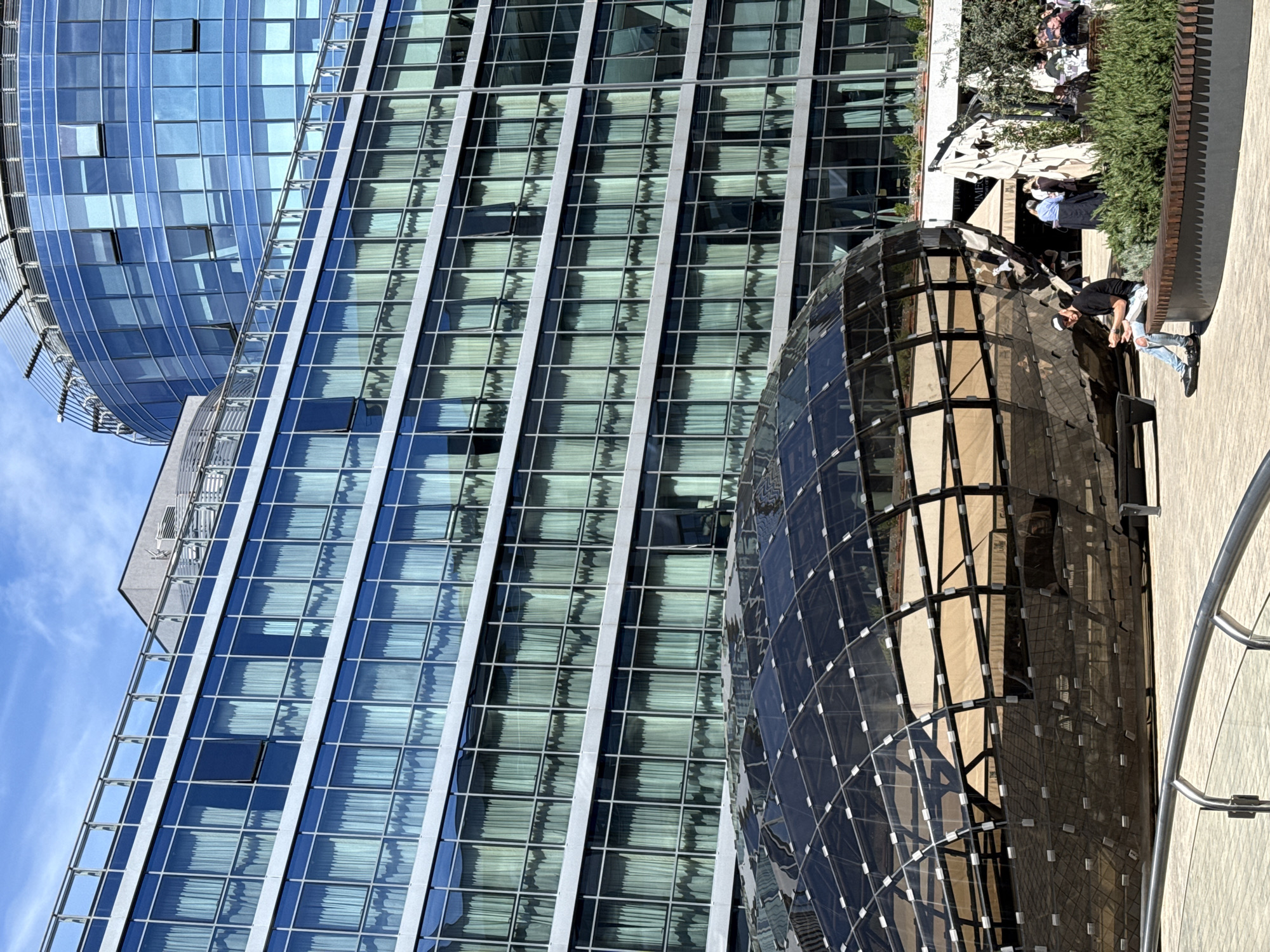 Woman takes selfies near modern architecture in Podgorica