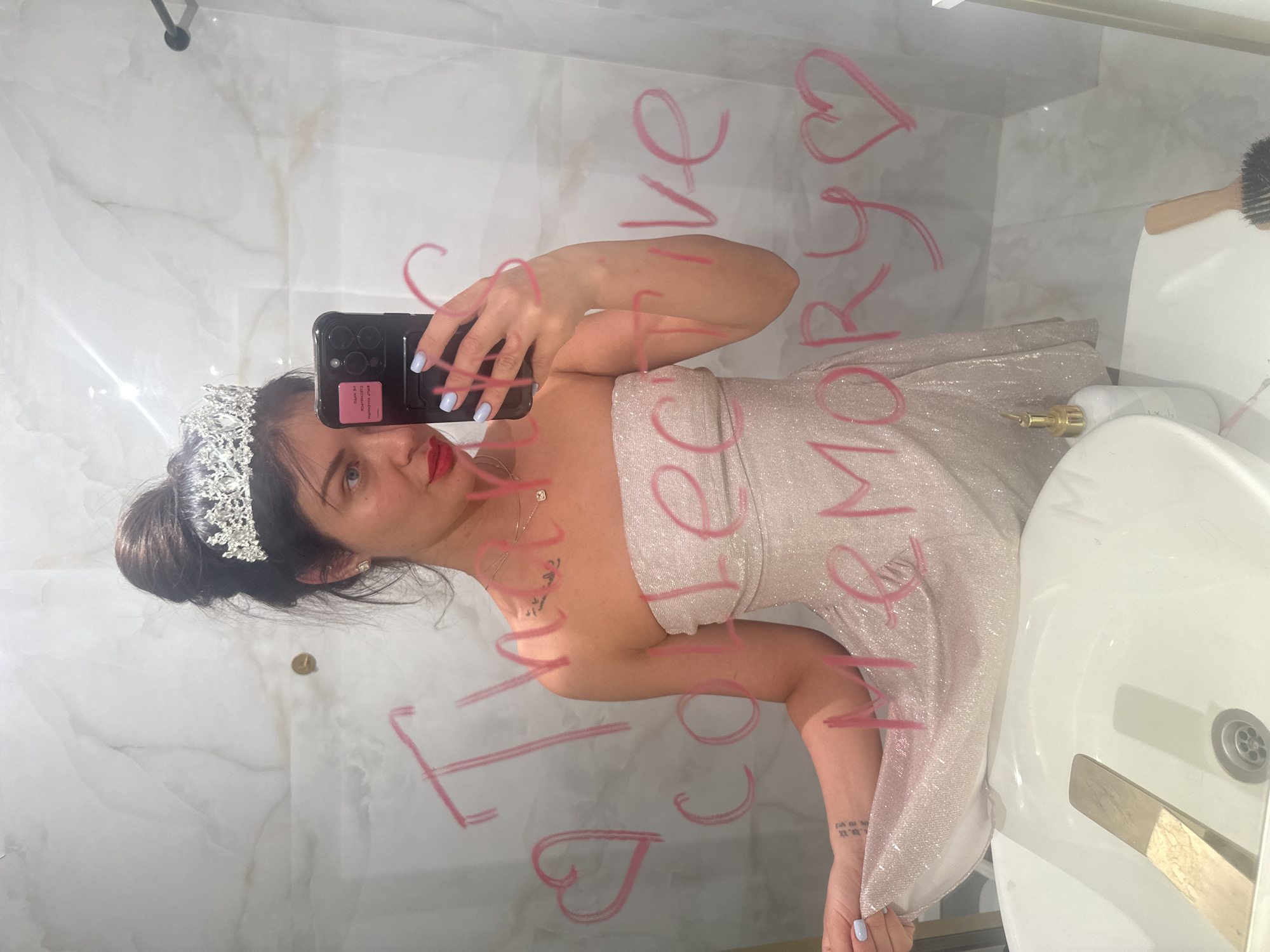 Woman in formal gown takes bathroom selfie in Khimki