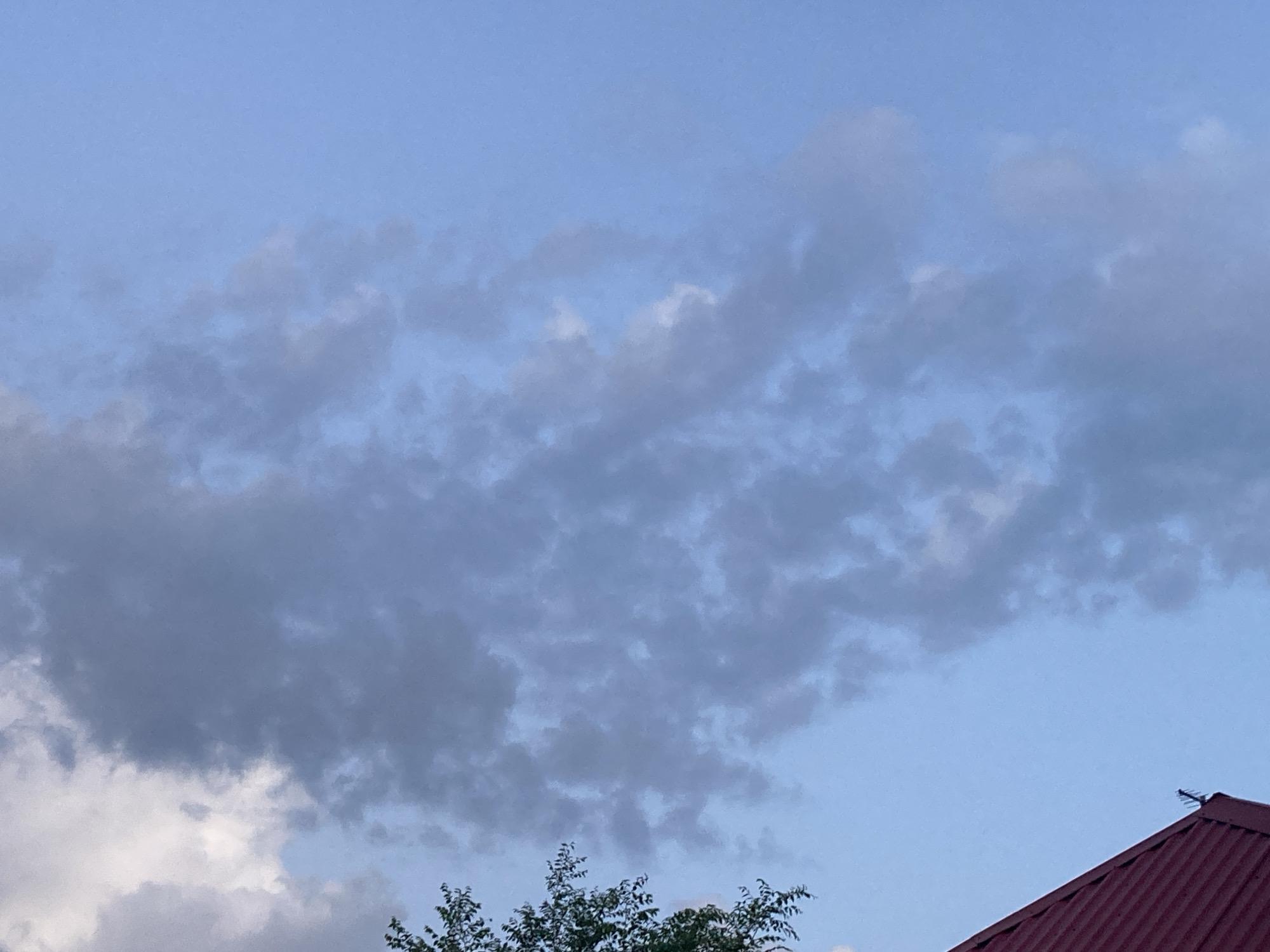 Dusk settles over a quiet Russian village in summer