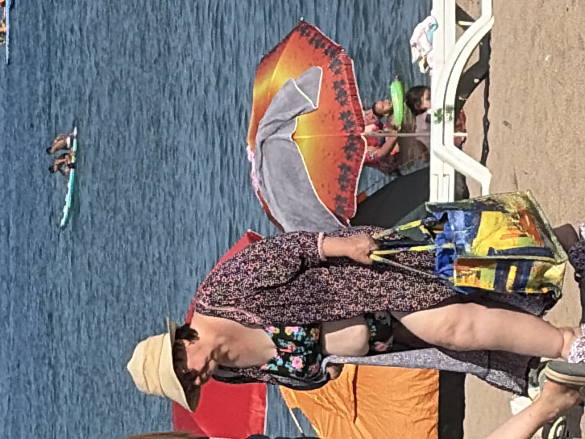 Beach day: water sports, shoreside hangouts, and a mystery pod offshore