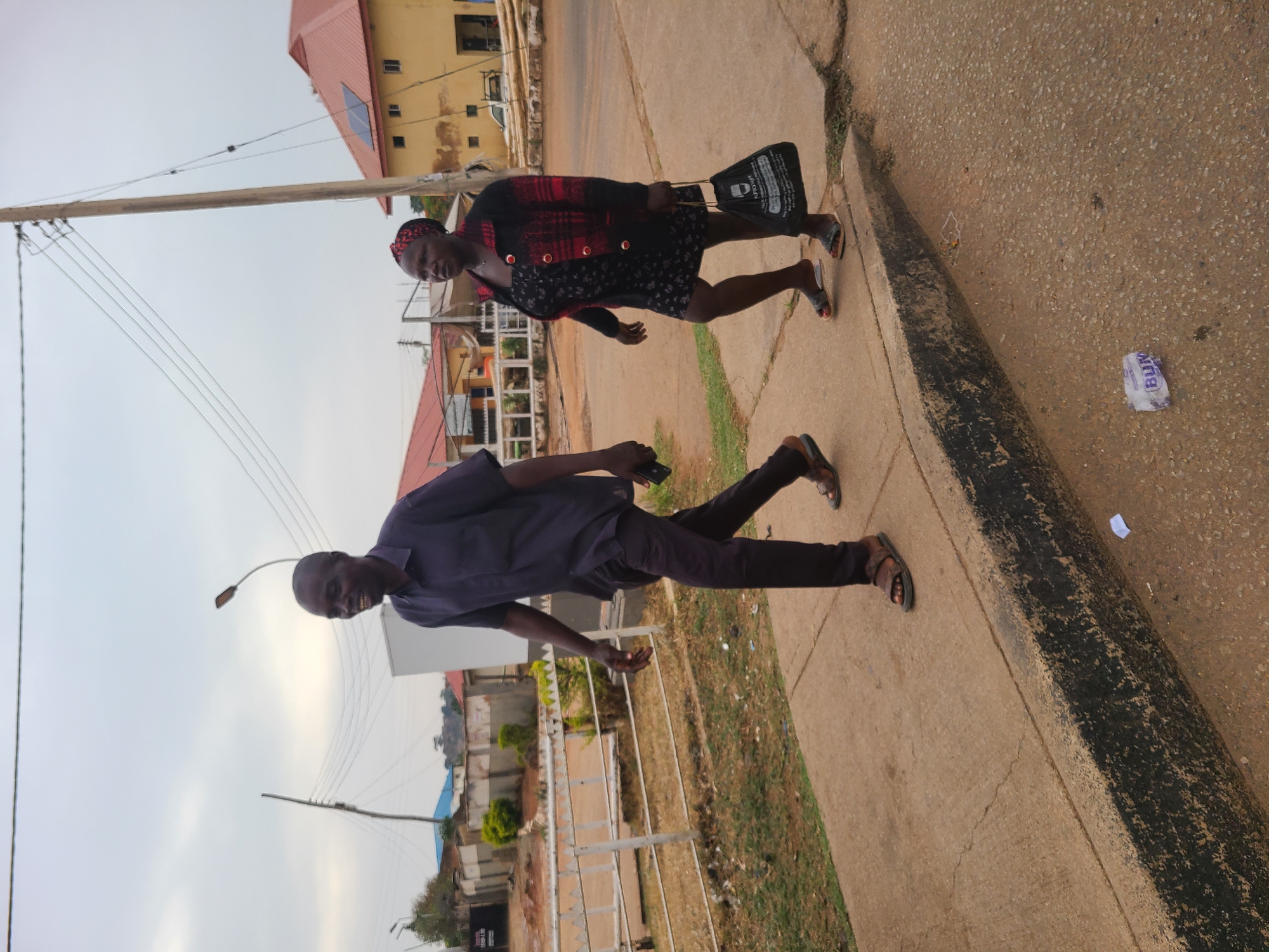 Pedestrians captured on Jos streets during afternoon hours