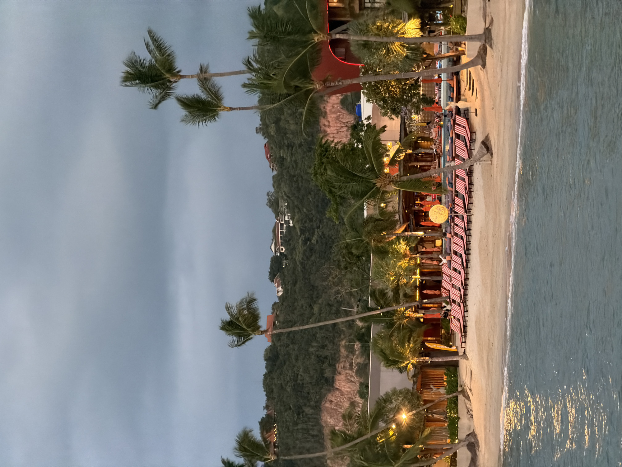 Sunset at a Ko Samui pier, boats docked, calm water