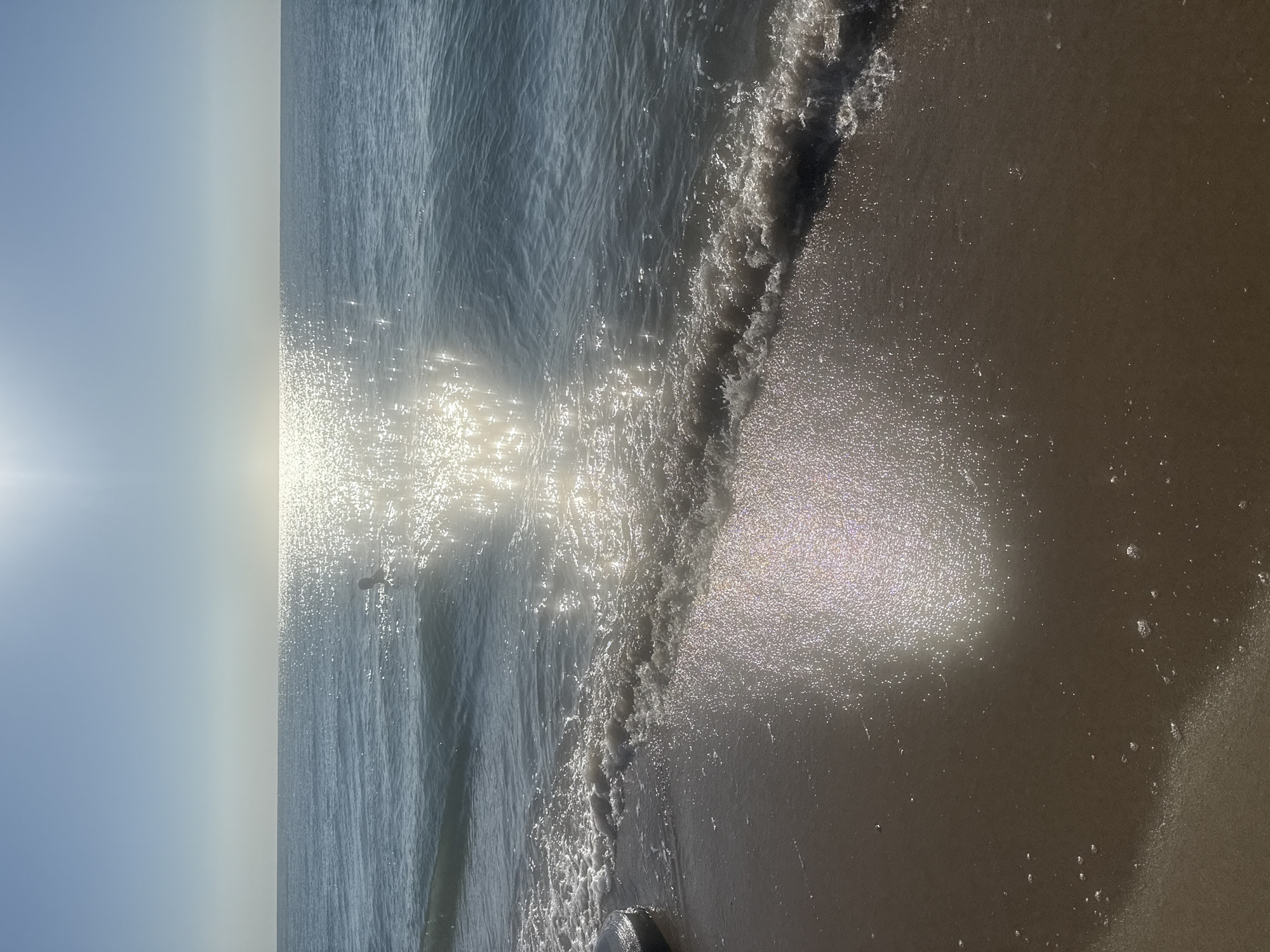 Quiet morning at the Zatoka shoreline, waves and wet sand