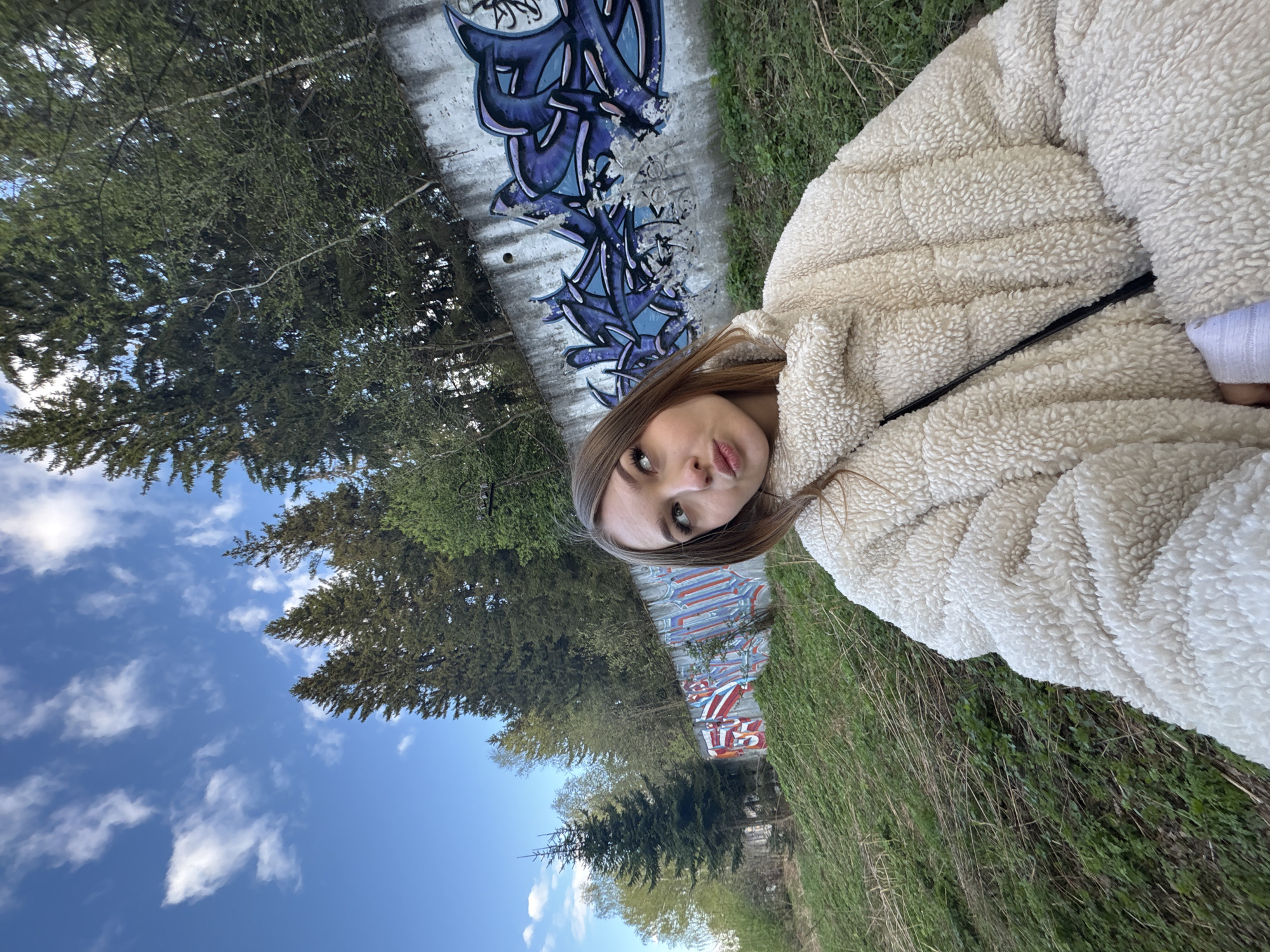 Woman spotted near graffitied wall in Chaikovsky park area