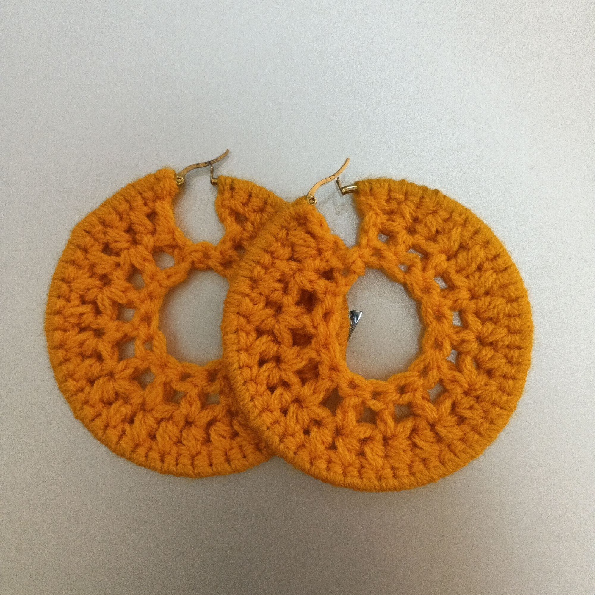 Handmade earrings and bold text graphics from Shaba