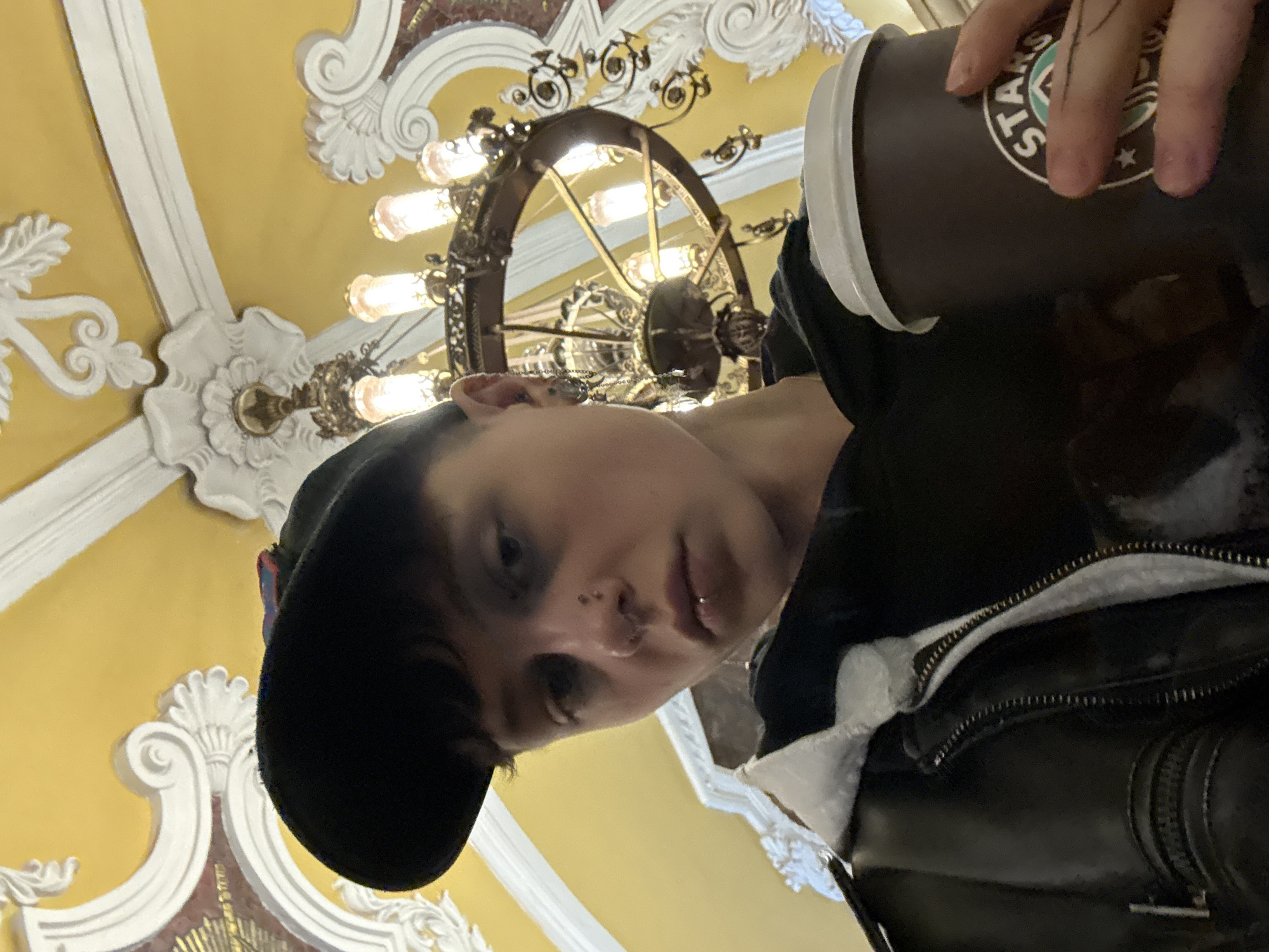 Coffee drinker spotted in ornate Moscow Metro station