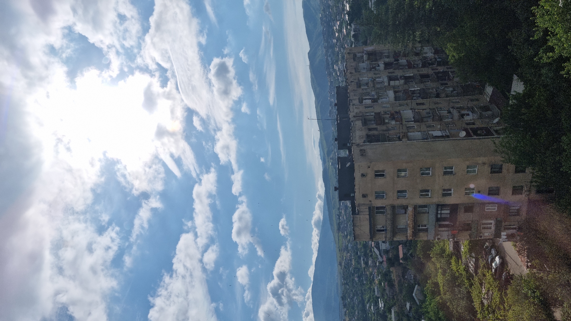 Morning coffee and rooftop views over Tbilisi's residential skyline