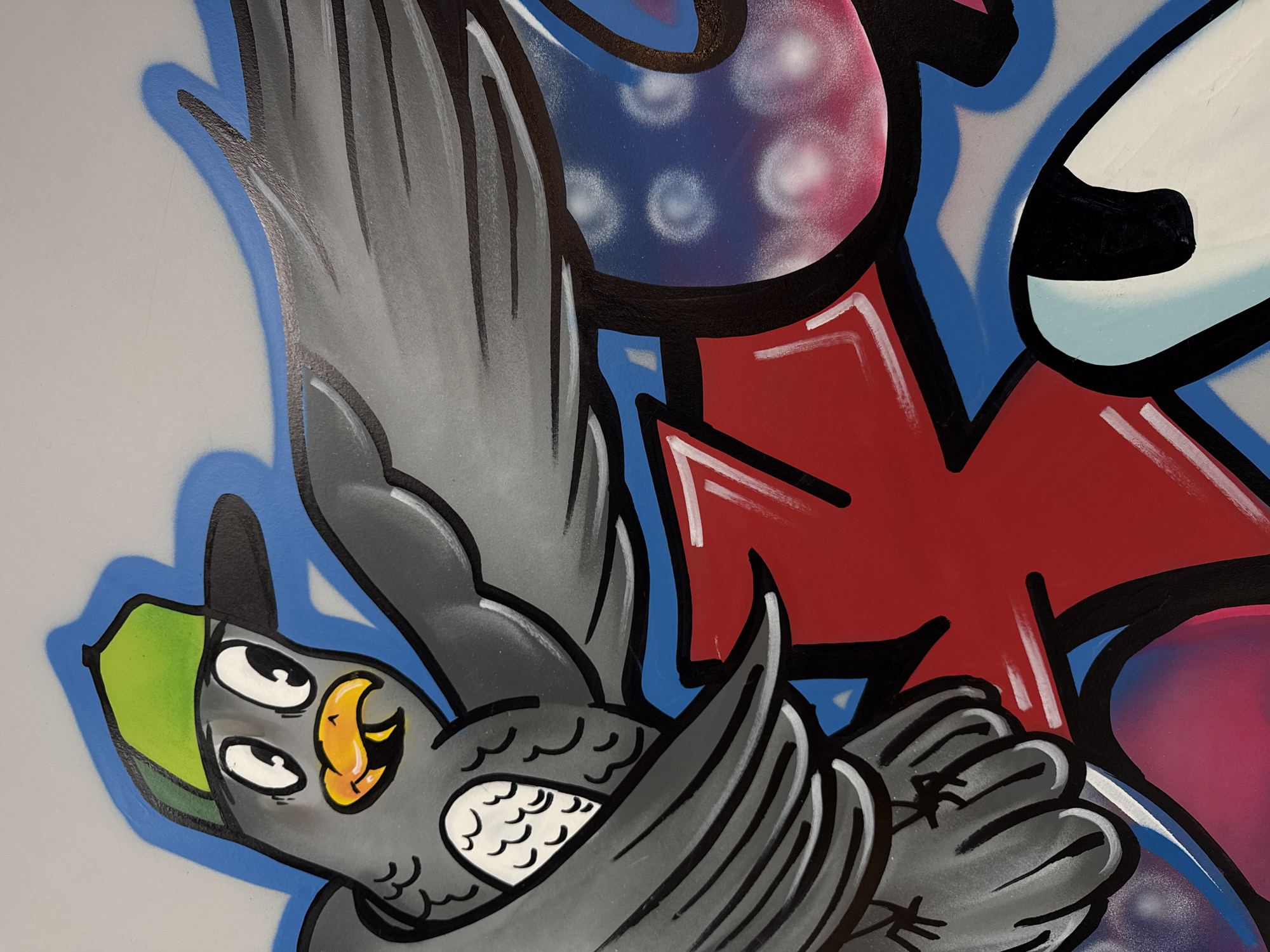 Vibrant bird graffiti mural documented in Vladivostok, Russia