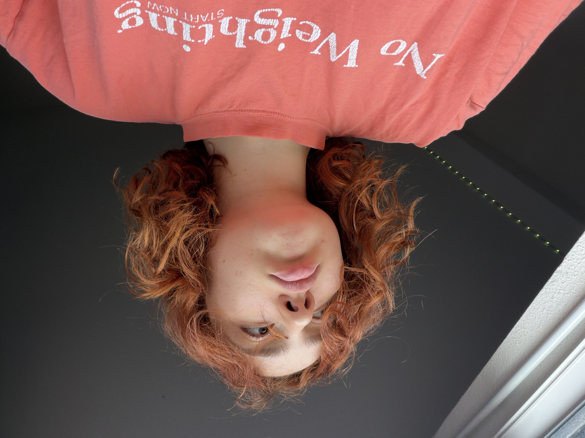 Person with red hair photographed from multiple angles in Strasbourg