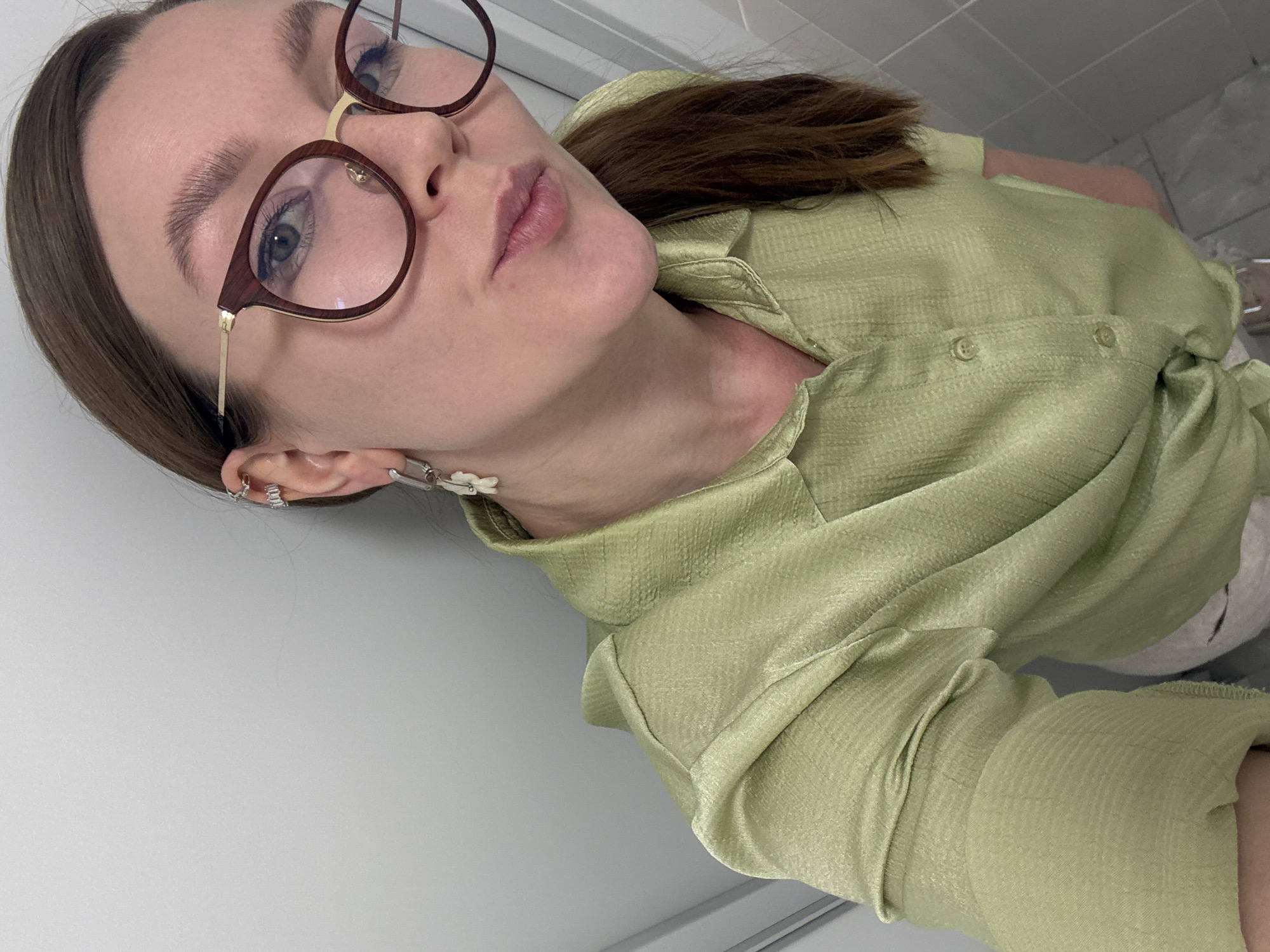 Woman photographed in indoor setting with plants in Izhevsk