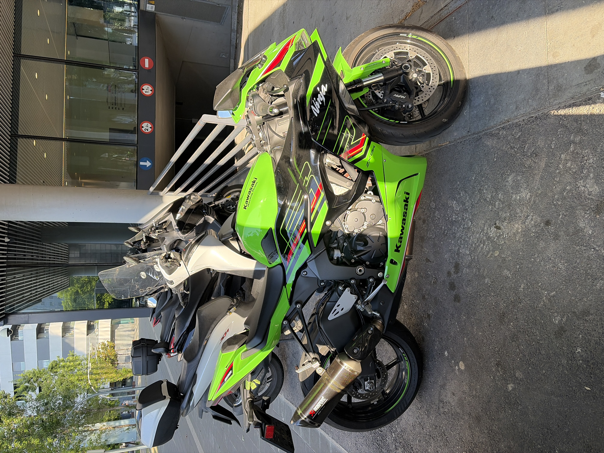 Kawasaki Ninja motorcycle parked during playground activity in L'Hospitalet