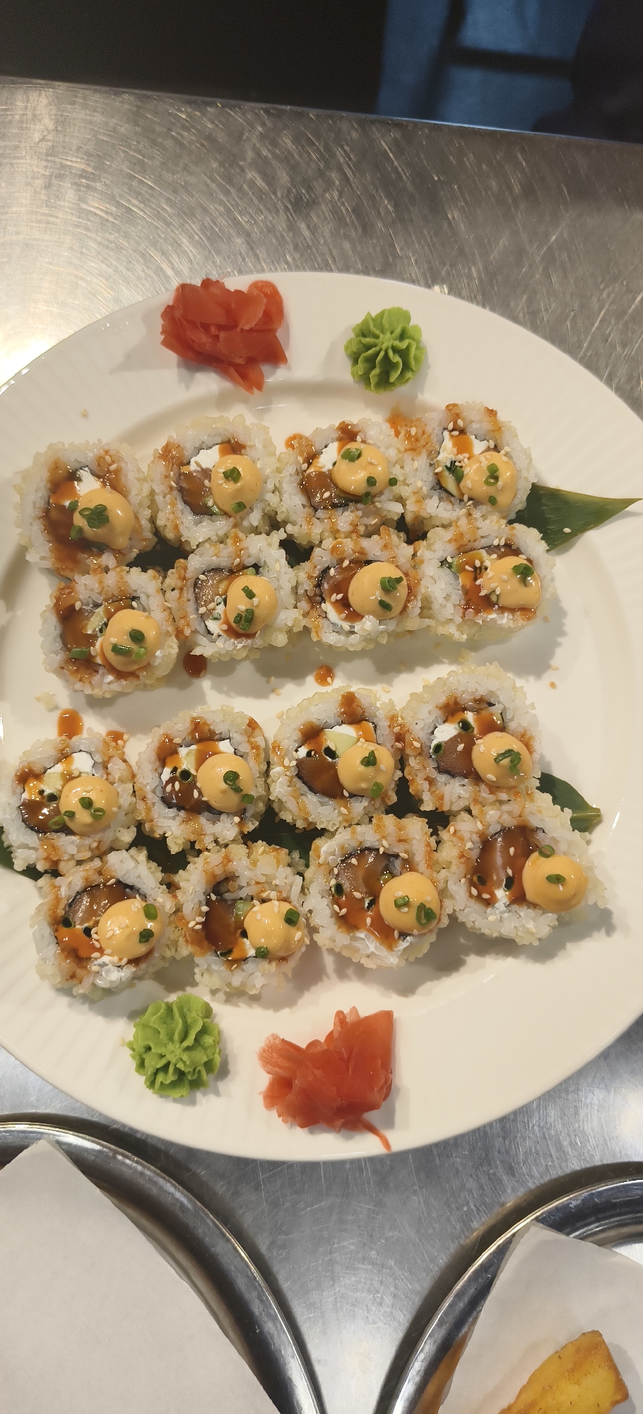 Food presentations documented: sushi rolls and yogurt dishes