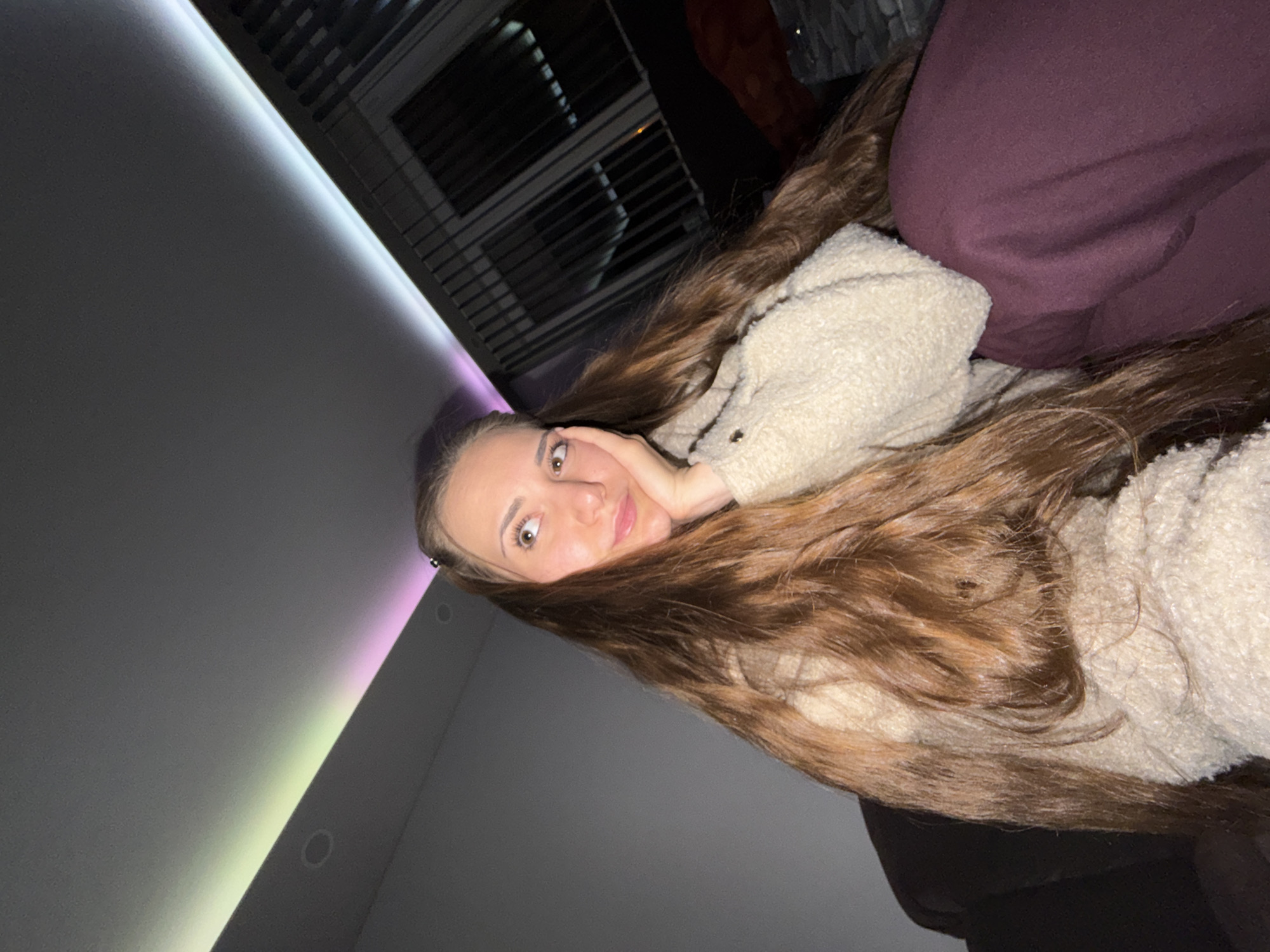Woman takes selfies during brief photo session in Bulgarian home