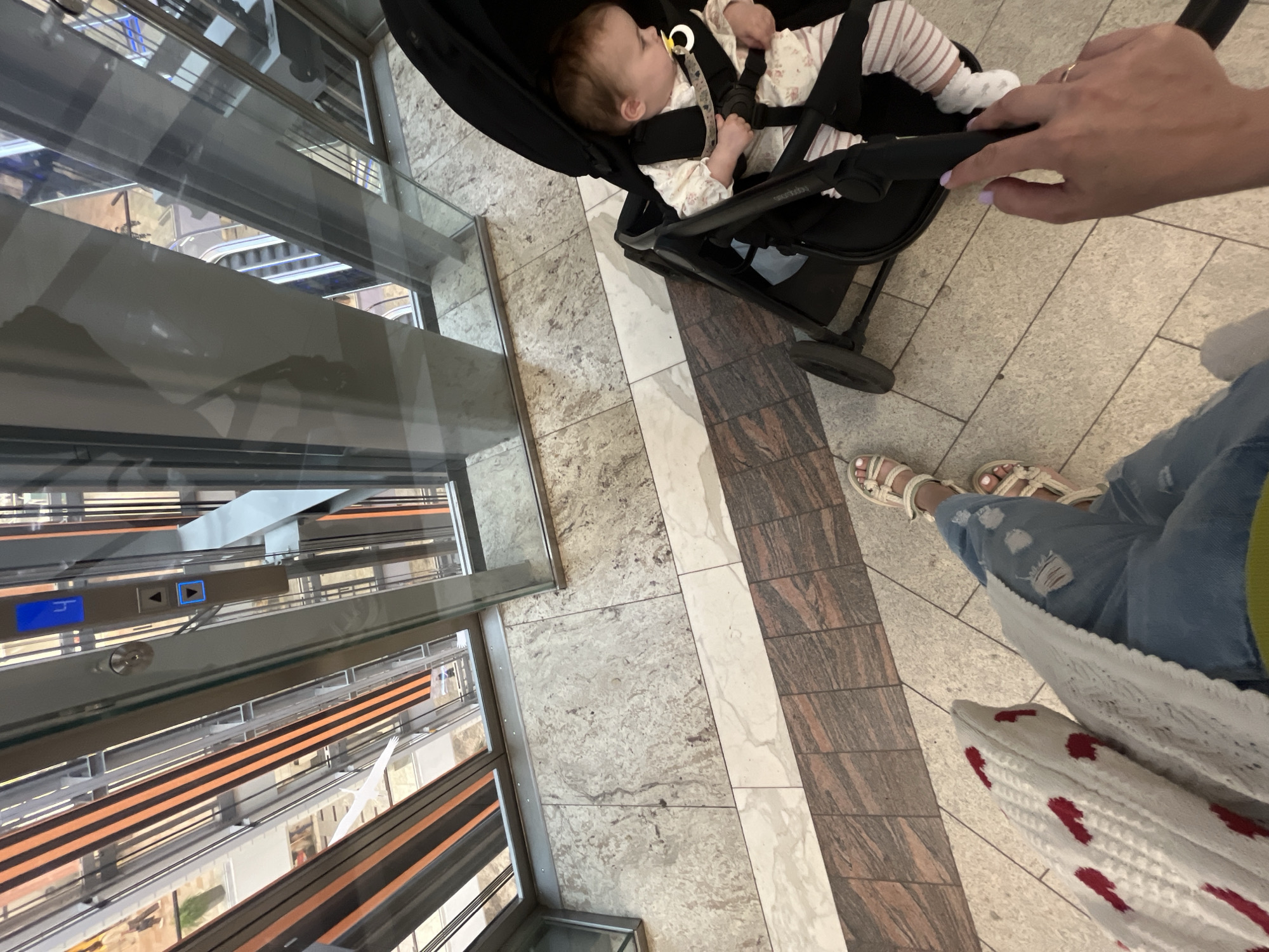 Inside a Russian shopping mall, stroller in tow