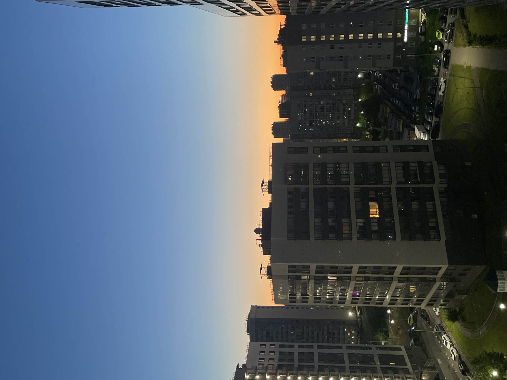 Twilight over Sinyavino's residential blocks, coffee in hand