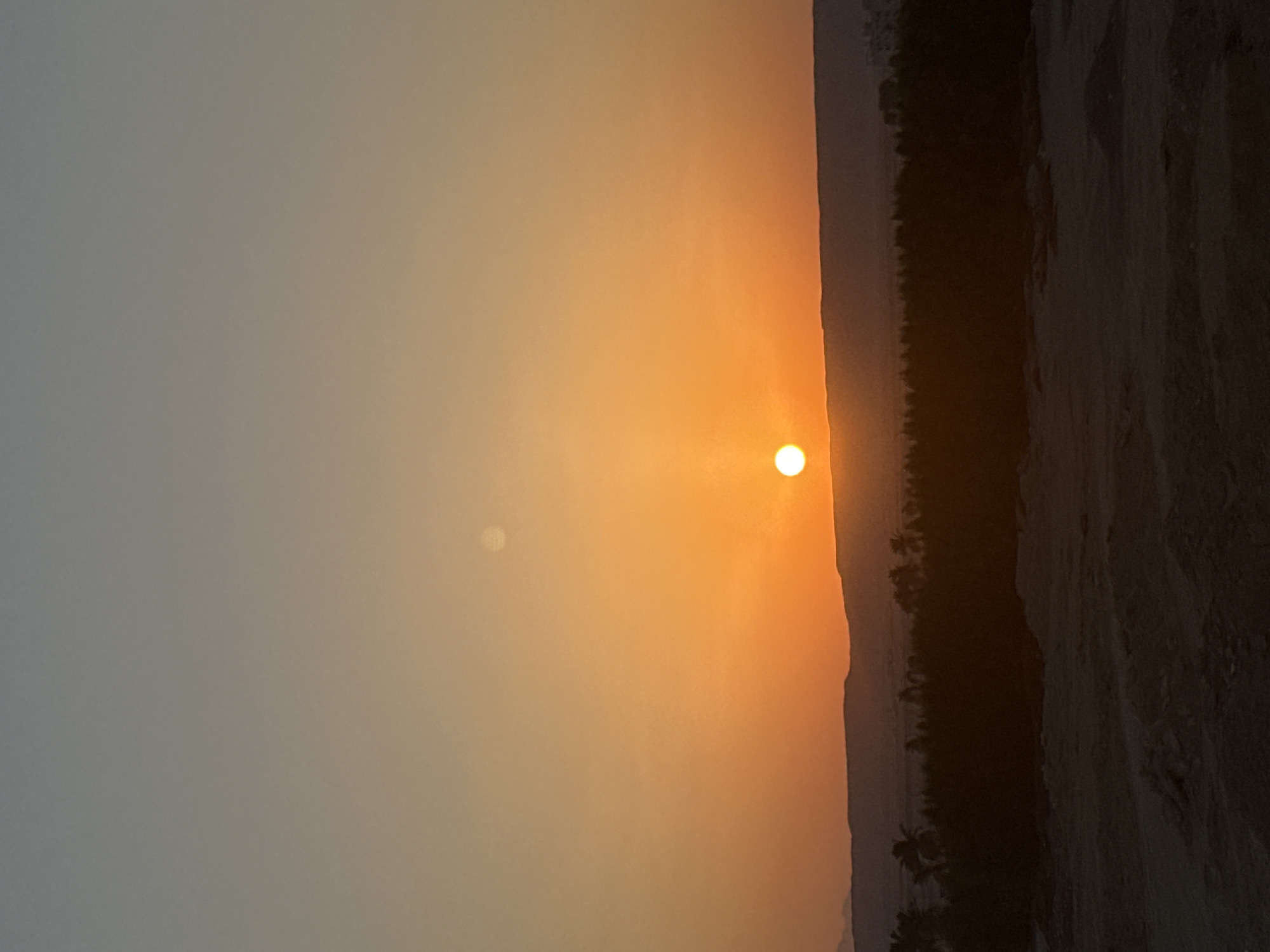 Desert sunset over Hurghada's outskirts, construction zones below