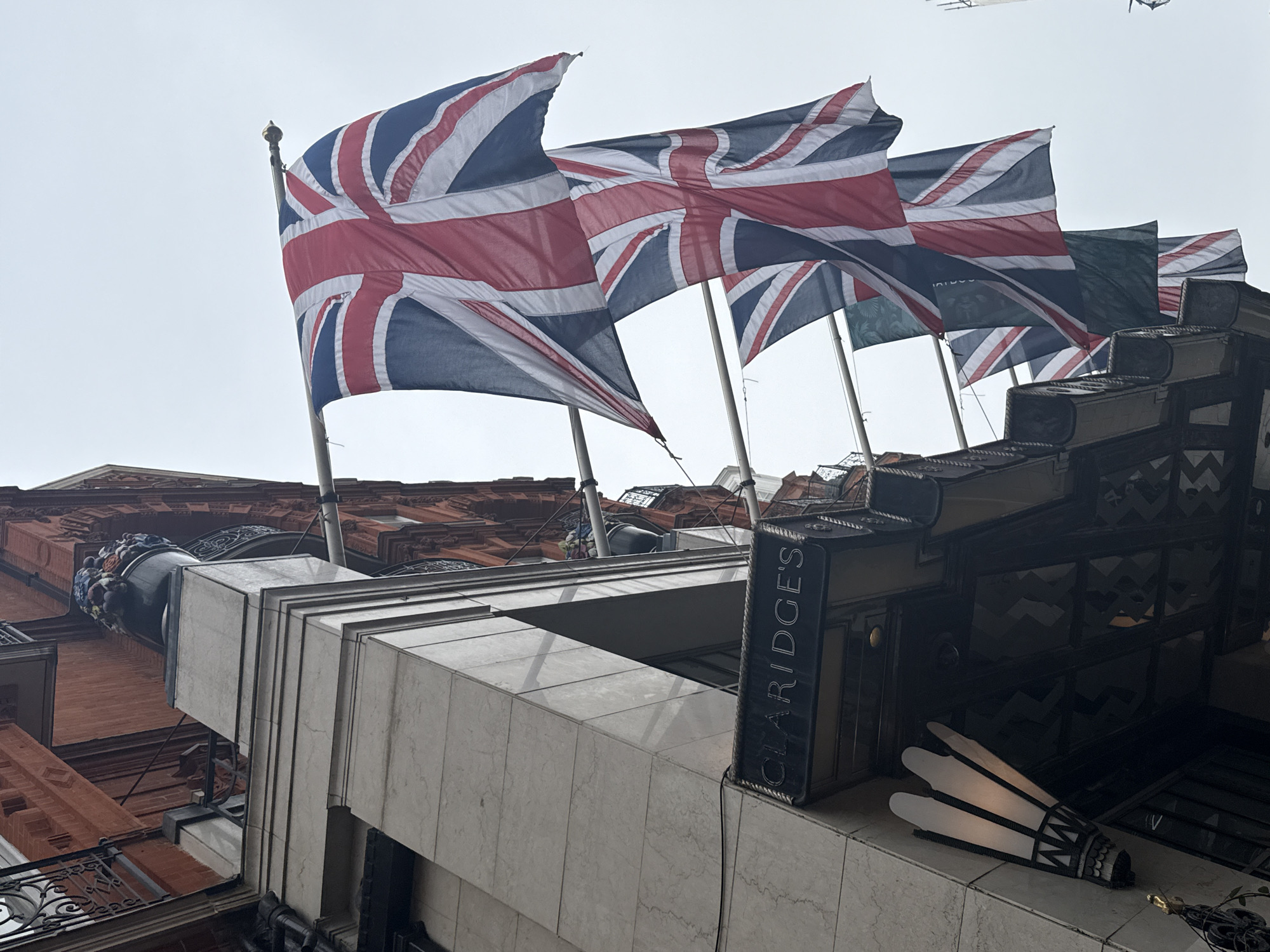 London morning scenes: hotel flags, craft displays, breakfast setting