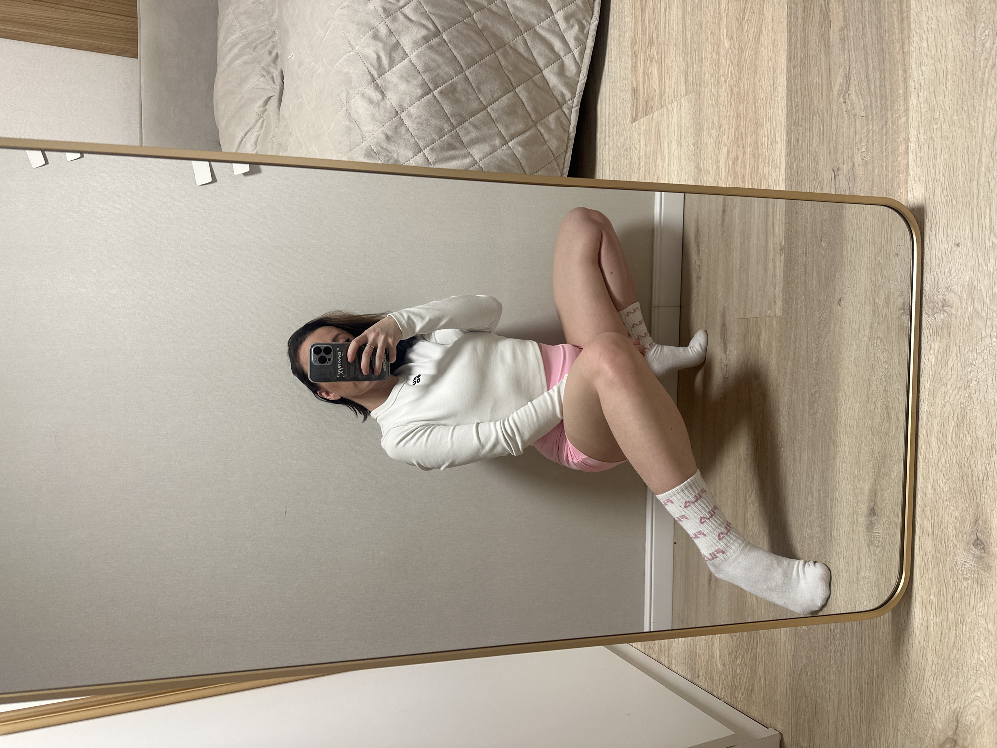 Woman takes mirror selfies in Votkinsk bedroom
