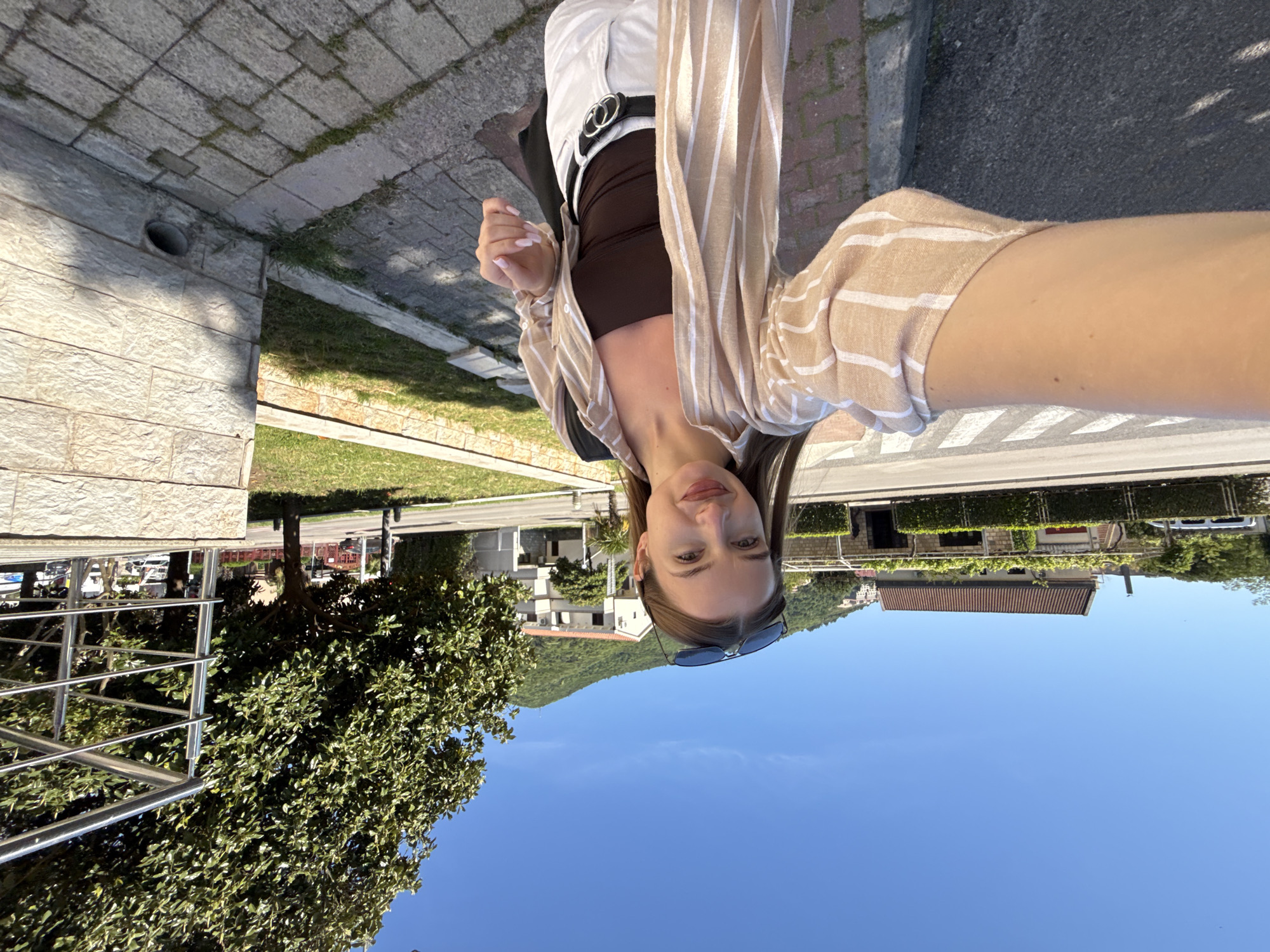 Woman takes outdoor selfie in Budva, Montenegro