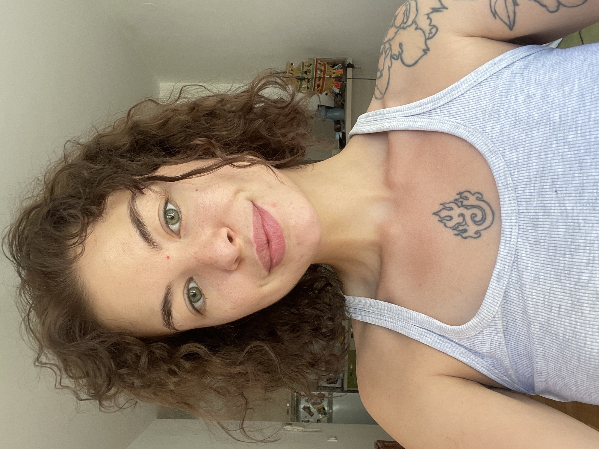 Back-to-back selfies in Boreti, Montenegro, same tattoos, different tops