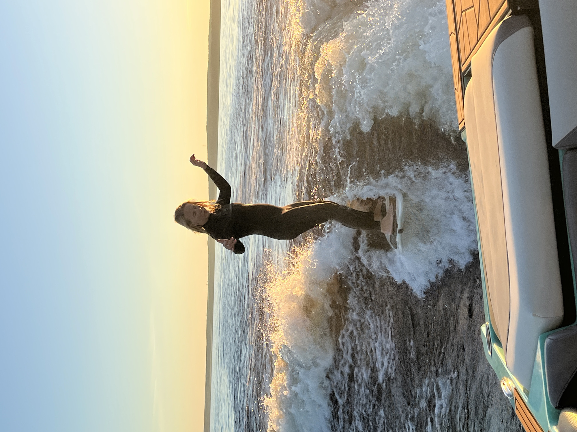 Sunset wakesurf session on a Russian lake