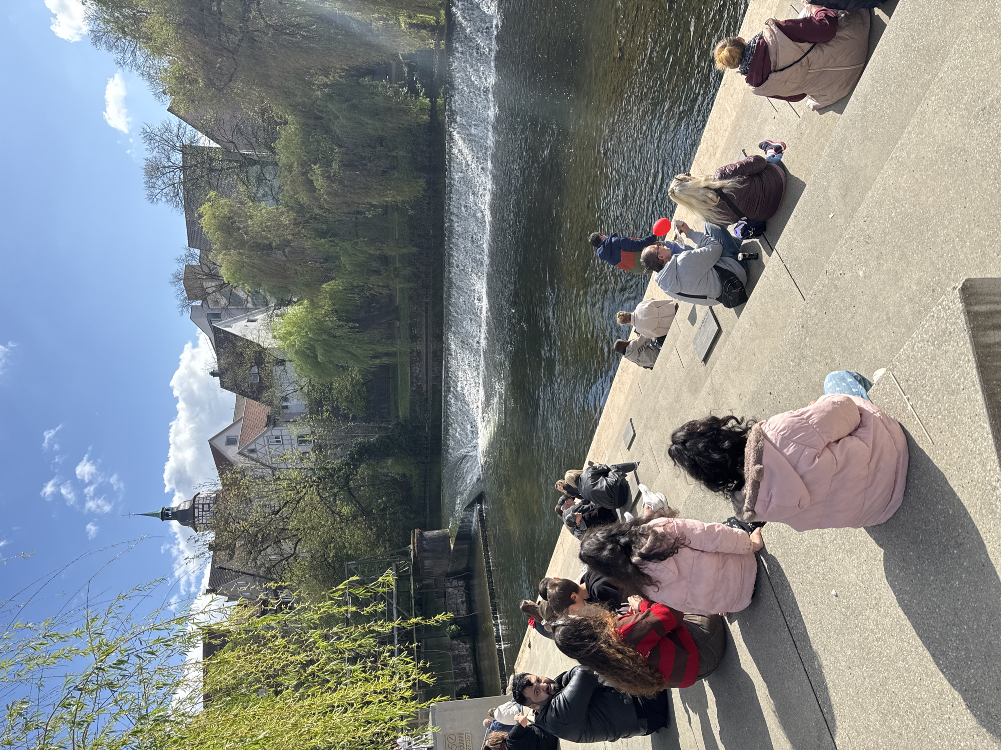 Afternoon gathering along Murr River waterfront in Backnang