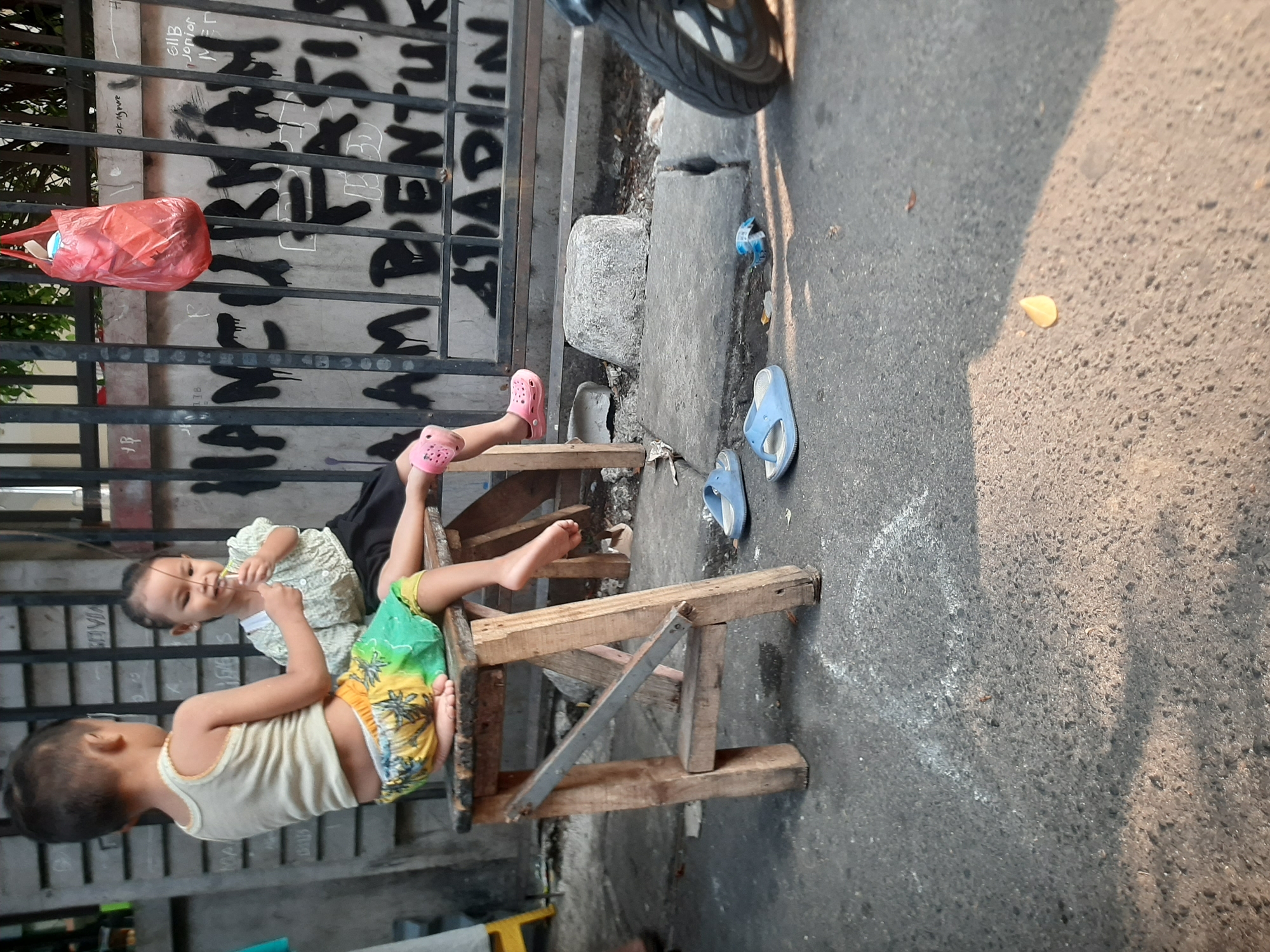 Everyday street life around a Central Jakarta neighborhood block
