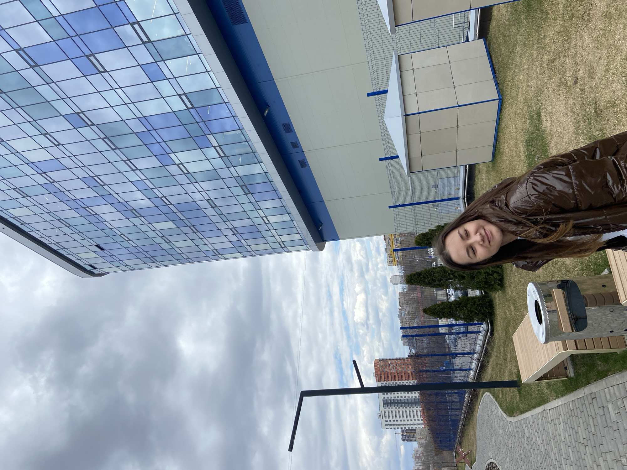 Woman poses with golden object in Izhevsk morning photo