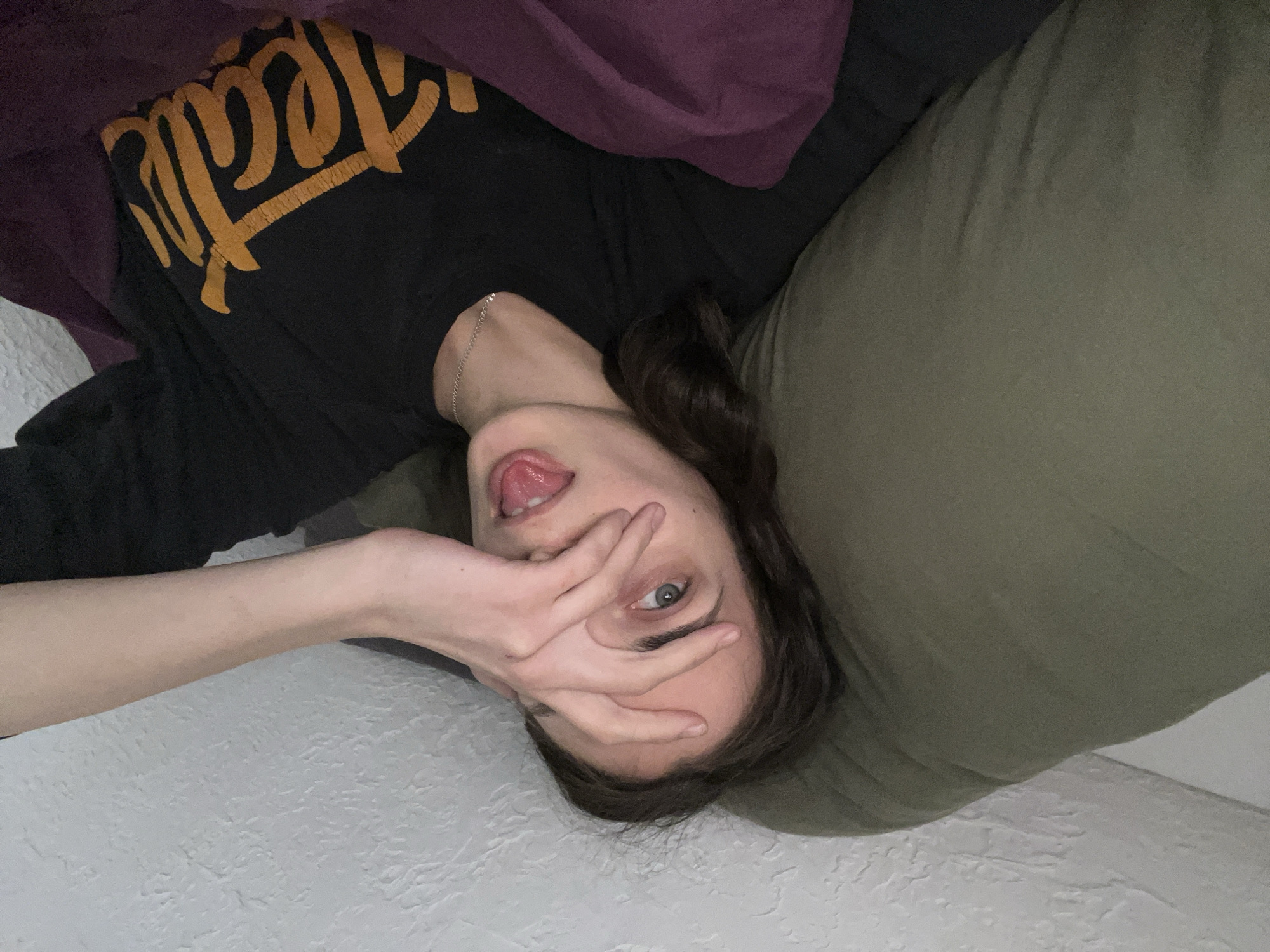 Woman resting indoors captured in Krasnoyarsk bedroom scene