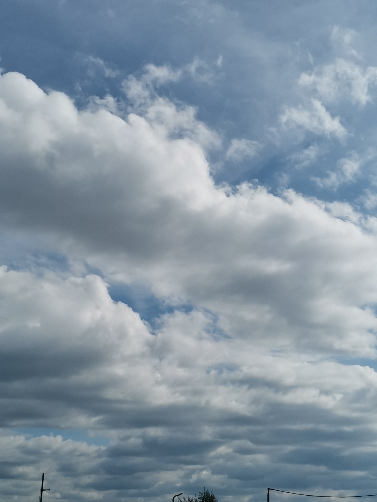 Mixed cloud formations observed over Sofia, Bulgaria afternoon