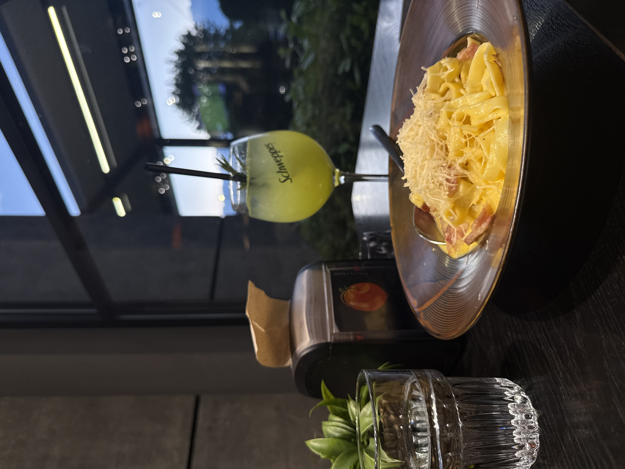Restaurant meal documented in Blagoevgrad featuring pasta and cocktails