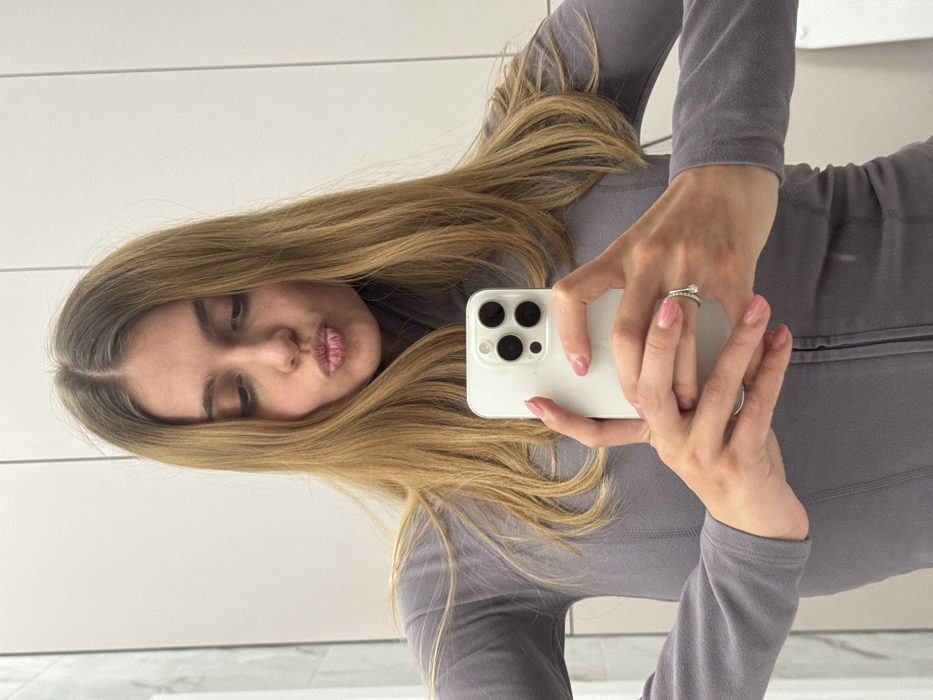 Woman takes bathroom selfies while snacking on prepared meal
