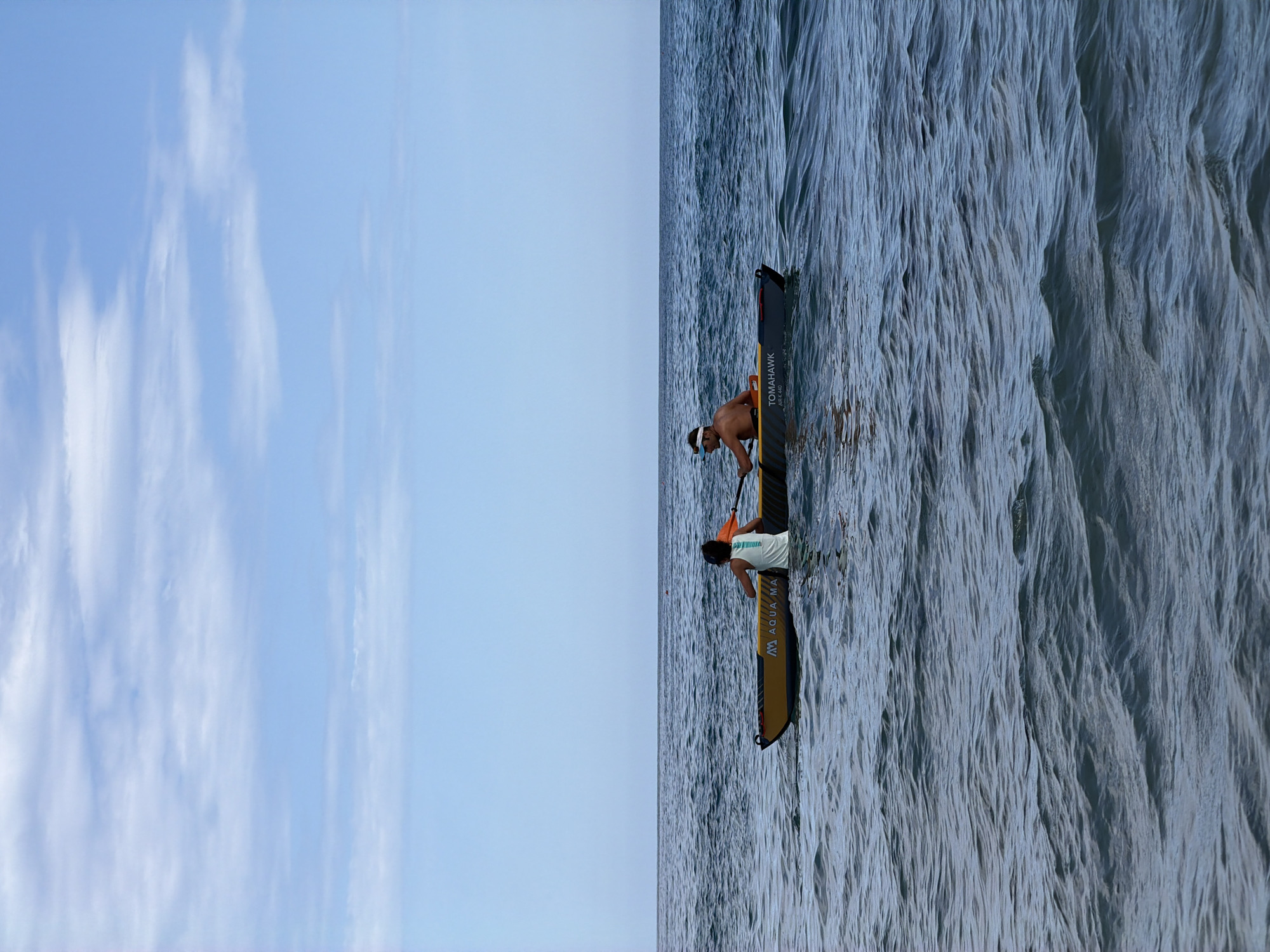 Kayaking session off Tortolì coast with rocky shores