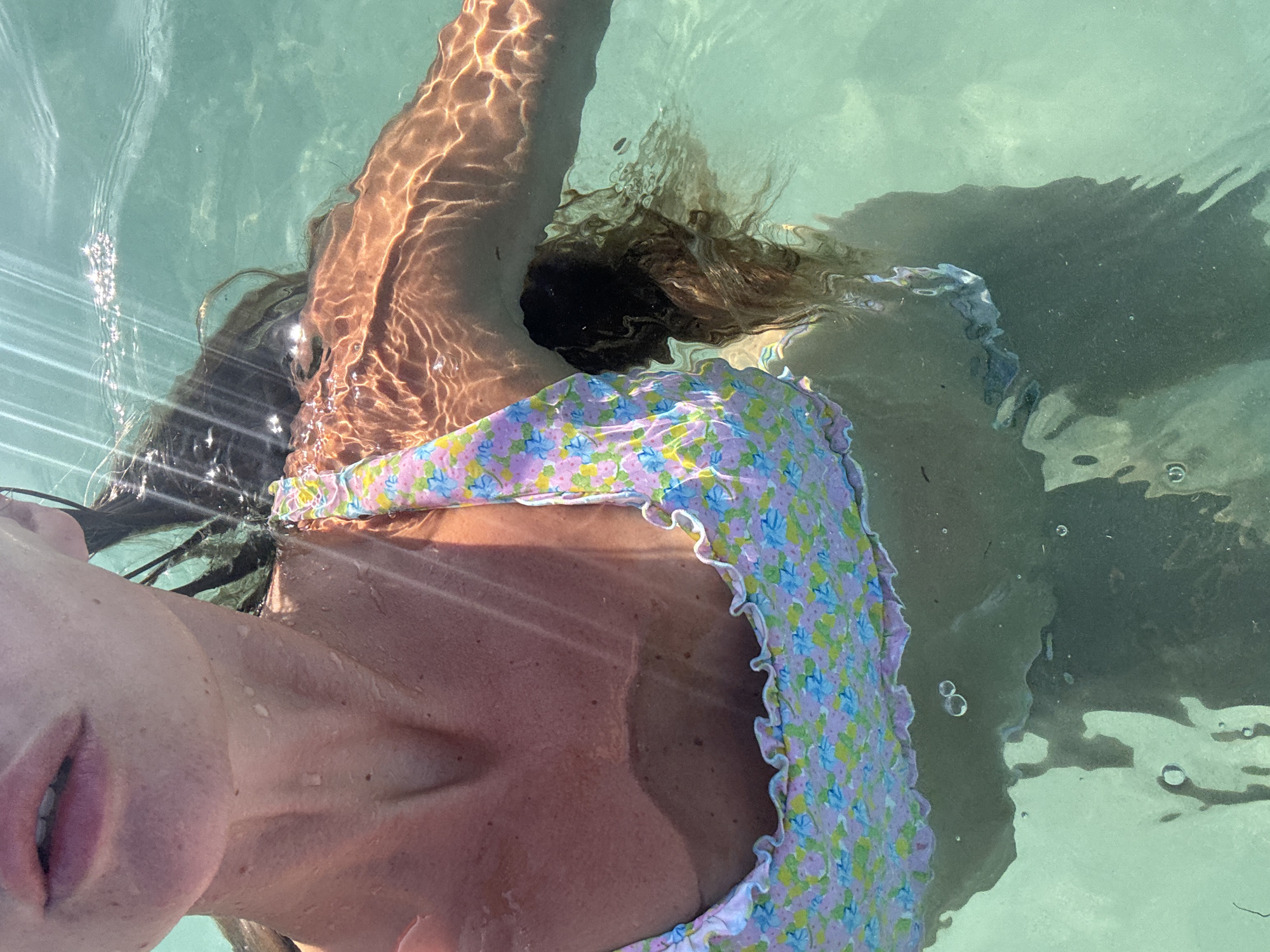 Woman swimming in clear Indonesian waters Friday morning