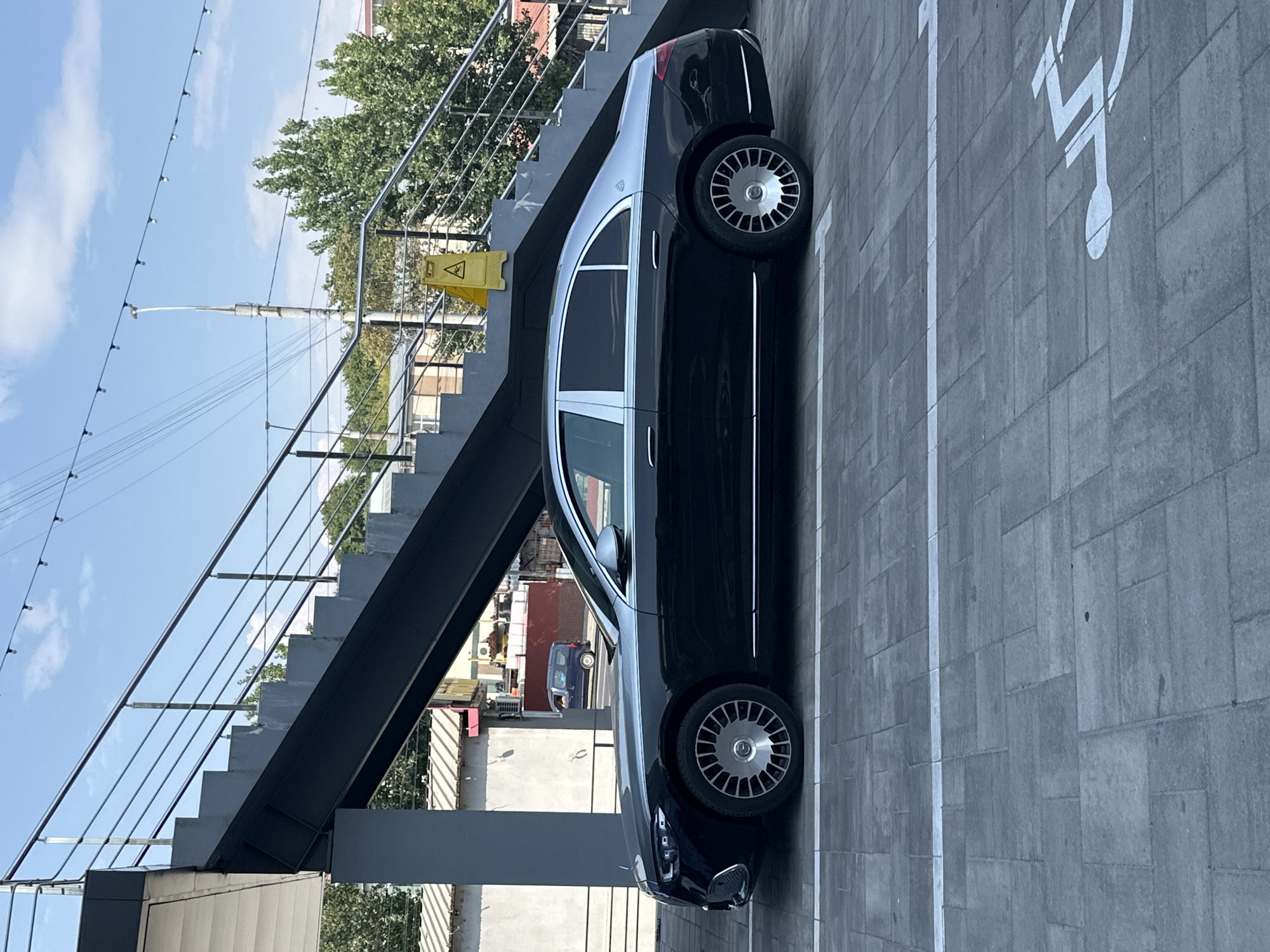 Inside a Chișinău BBQ store, plus a Maybach in the lot