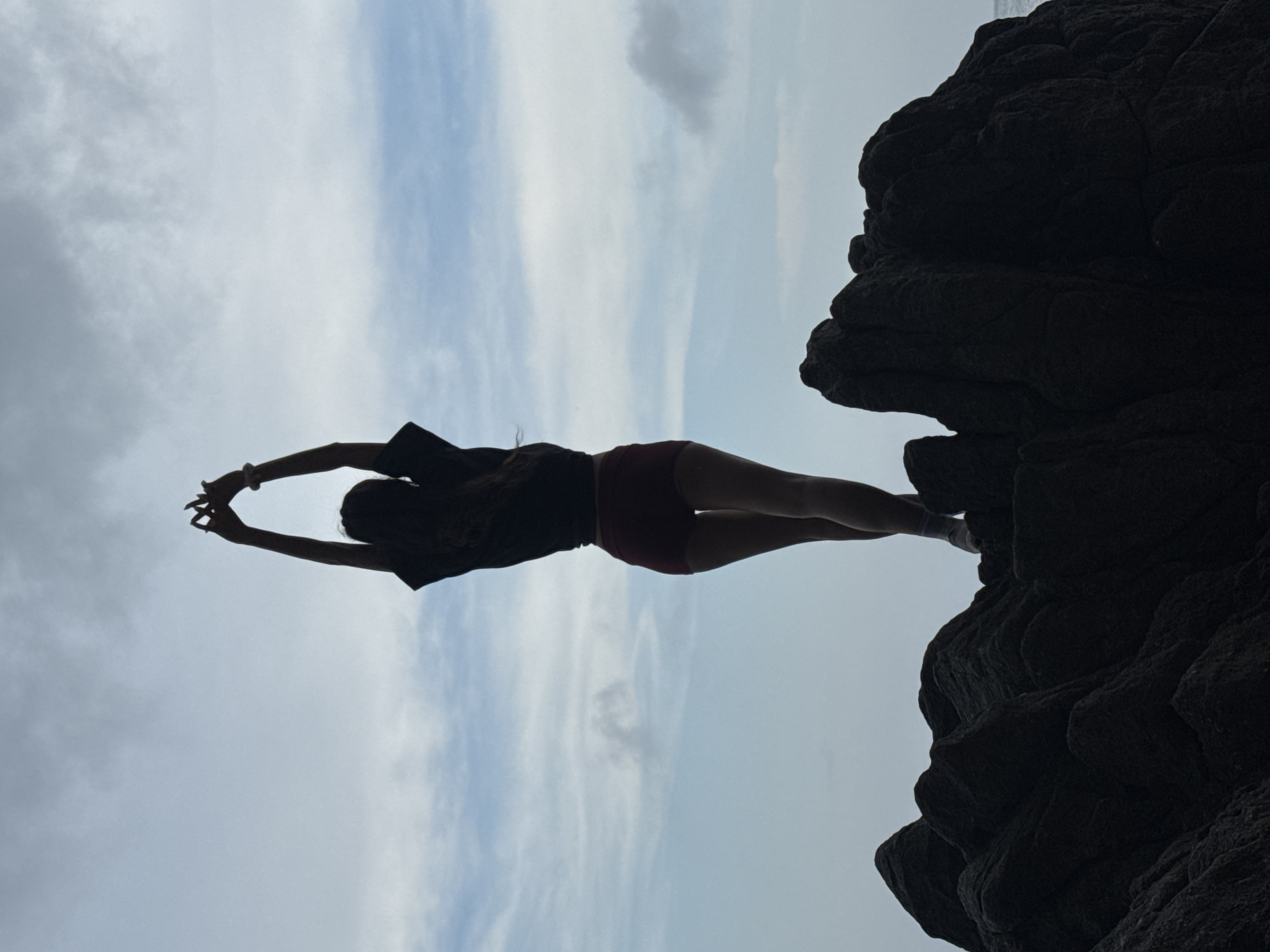 Tourists photograph coastal cliffs and caves at Đà Nẵng