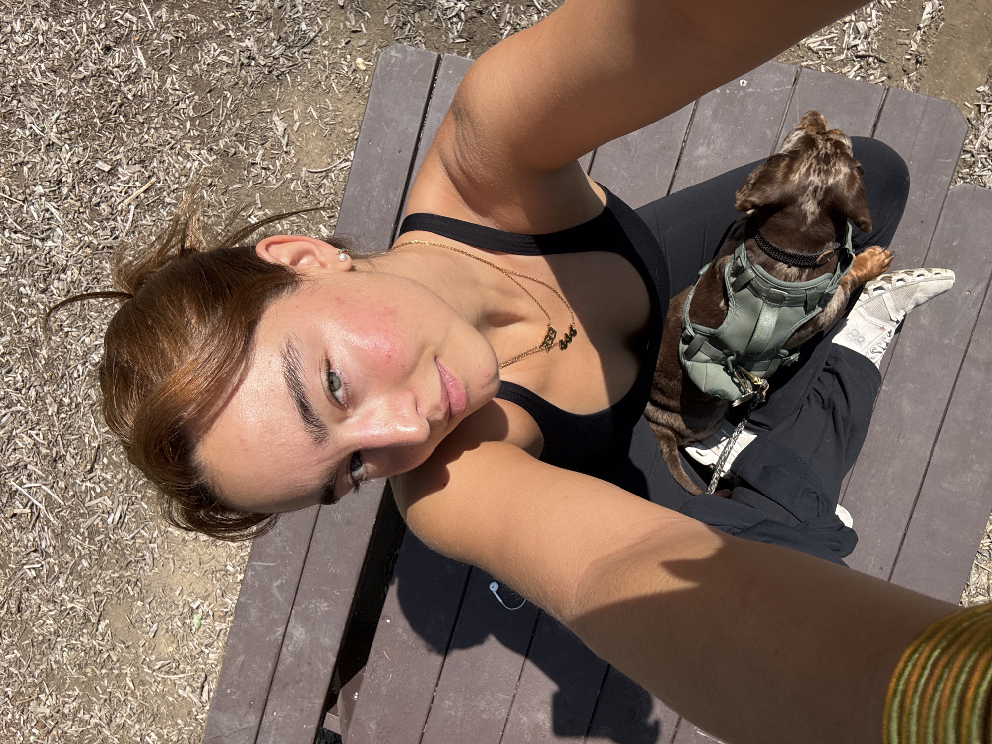 Woman documents park visit with dog at Los Angeles pond