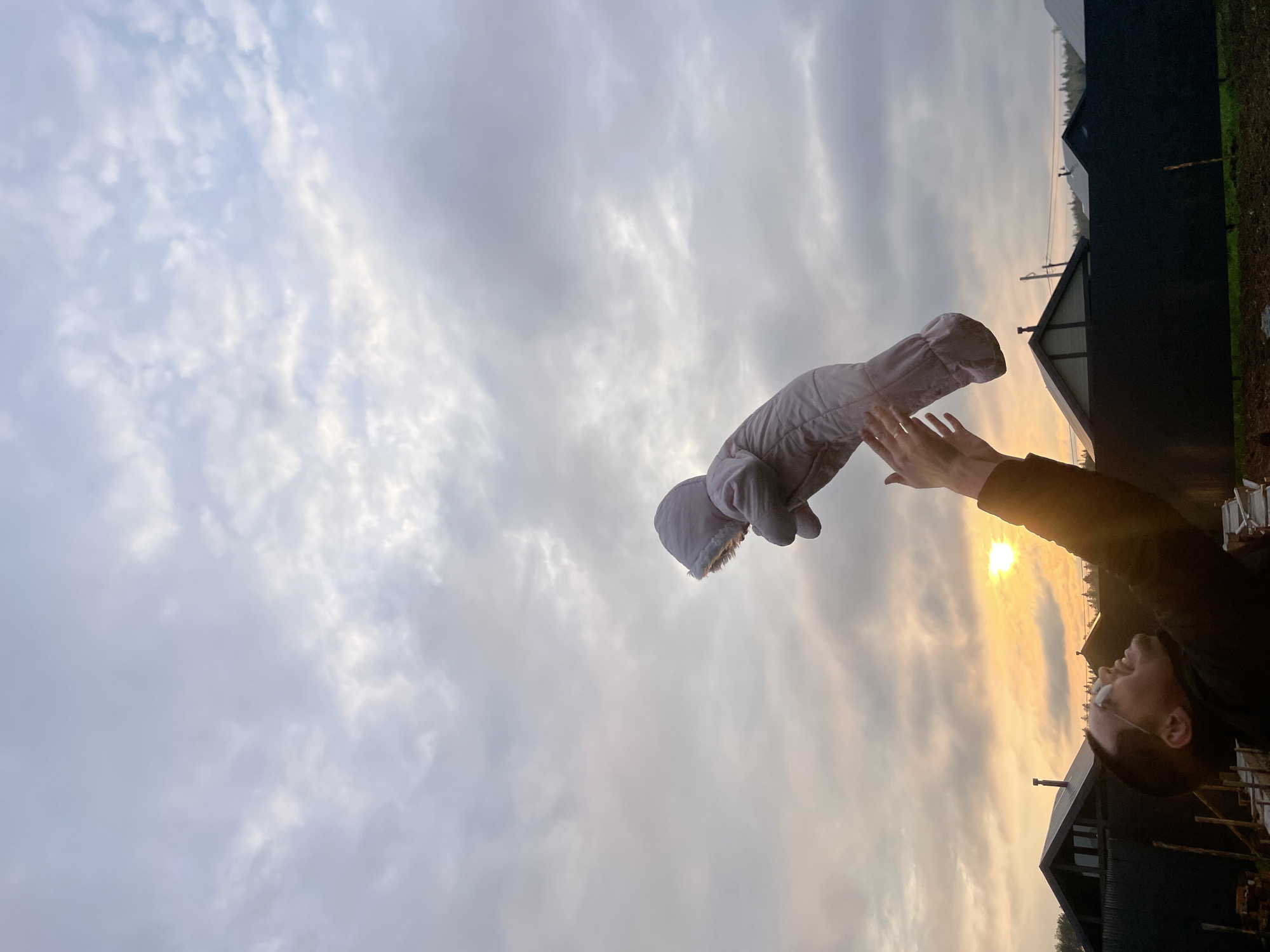 Person tosses baby snowsuit skyward in Russian village