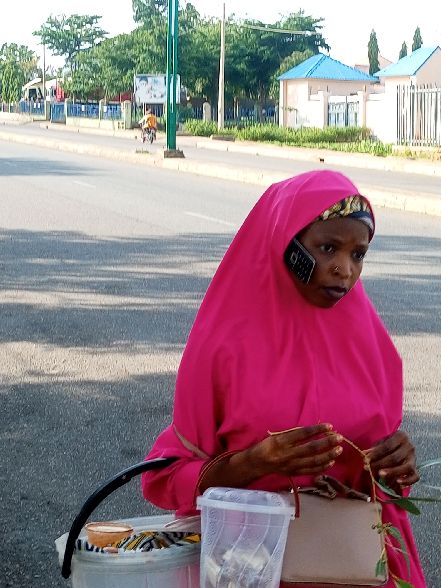 Street life in Tempure: phone calls and goods on the move