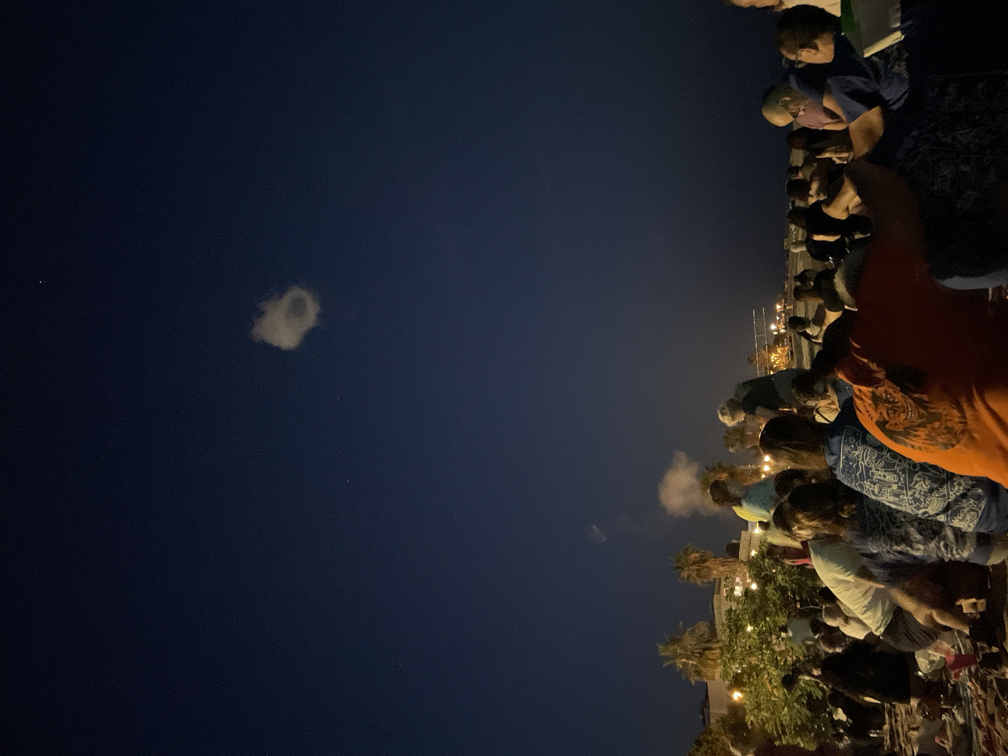 Full moon night gathering on the beach in Canet de Mar