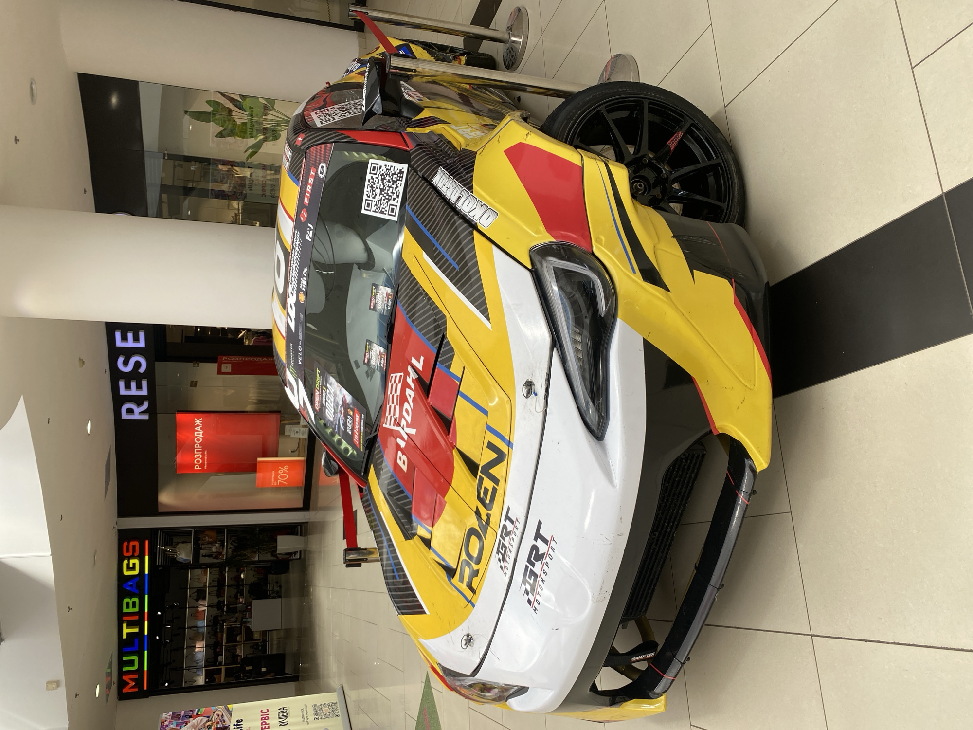 Race car on display inside a shopping mall